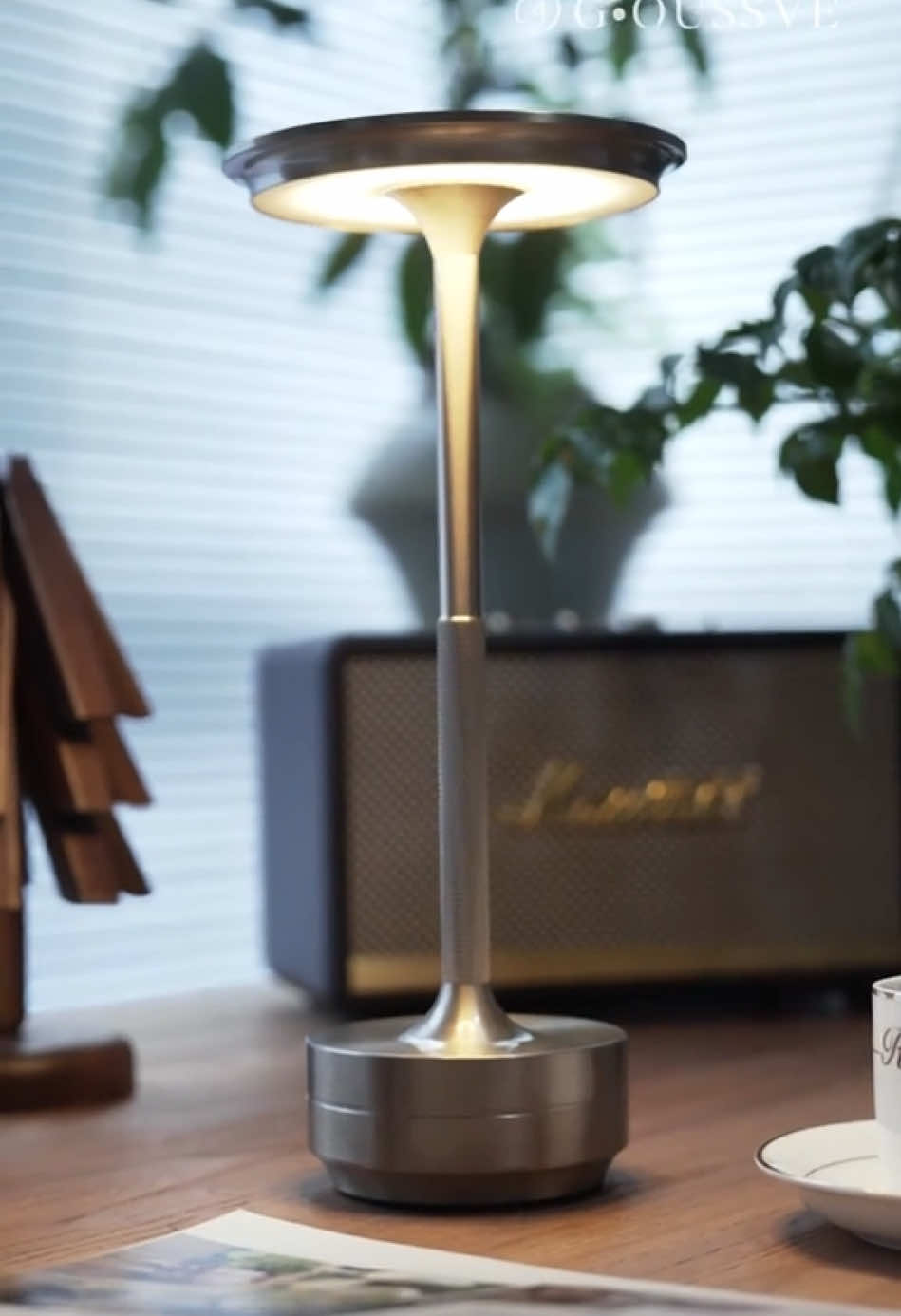 Ambient table lamp, all-metal texture, strong artistic atmosphere.
