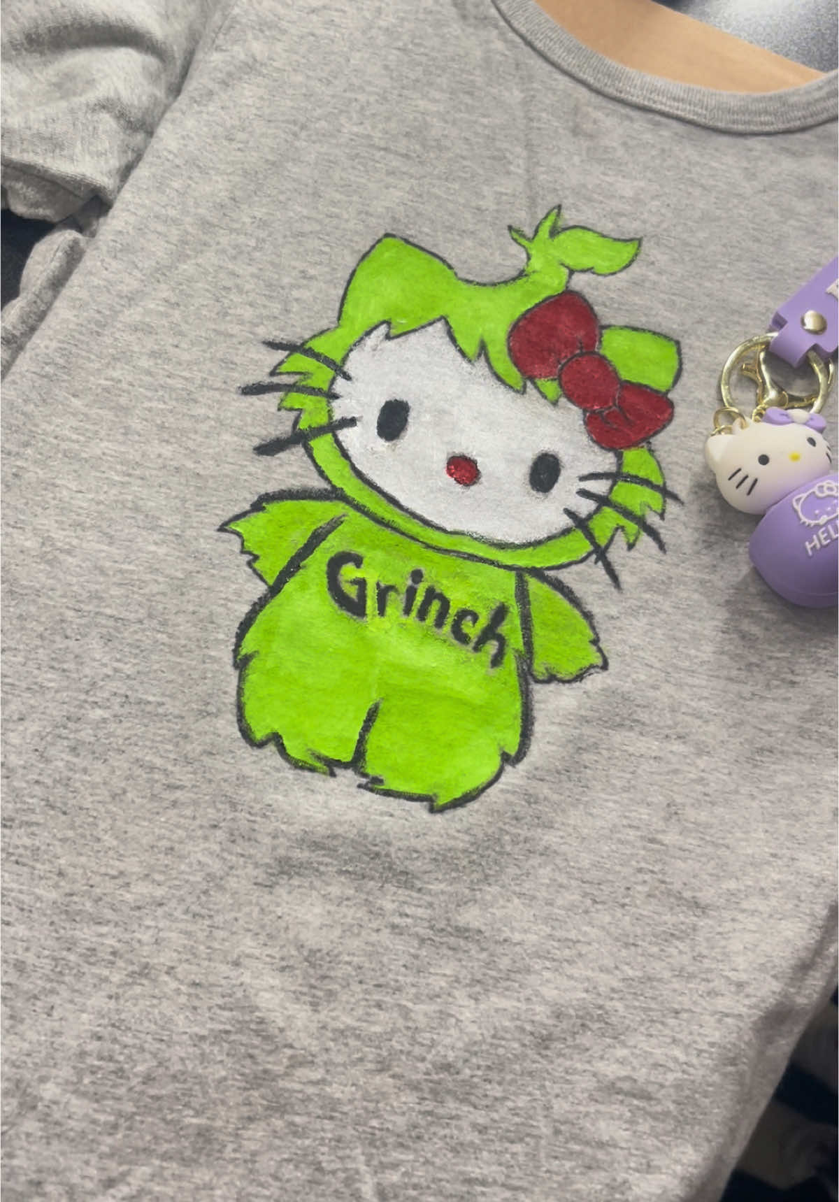 When its grinch day at your daughter’s school but she doesnt have anything grinch & its too late to go out for something, mom makes it happen for her💚 #grinch #christmas #school #momlife #MomsofTikTok #hellokitty #sanrio #clothes #outfit #tiktok #tik #tok #fyp #foryoupage #painting #paint #art 