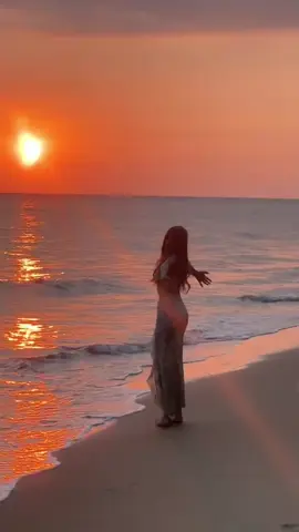 A beautiful girl watching the sunset