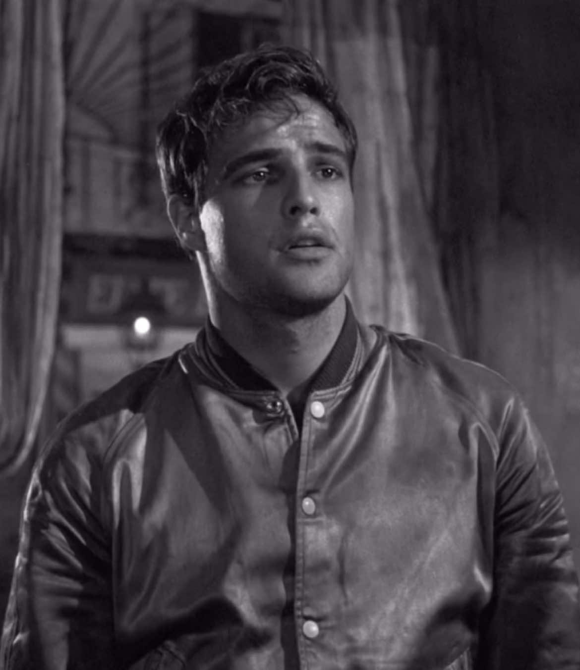 Marlon Brando’s performance as Stanley Kowalski in A Streetcar Named Desire revolutionized depictions of masculinity and men’s fashion. His portrayal of the working-class man broke away from traditional, reserved male characters. Brando’s iconic look—tight t-shirts and rugged, unpolished style—set a new standard for casual masculinity, symbolizing physicality and raw emotion over refinement. His performance inspired a more modern, complex image of masculinity, one that blended strength with vulnerability, influencing both film and fashion for years to come. #marlonbrando #astreetcarnameddesire #oldhollywood #classicmenswear 