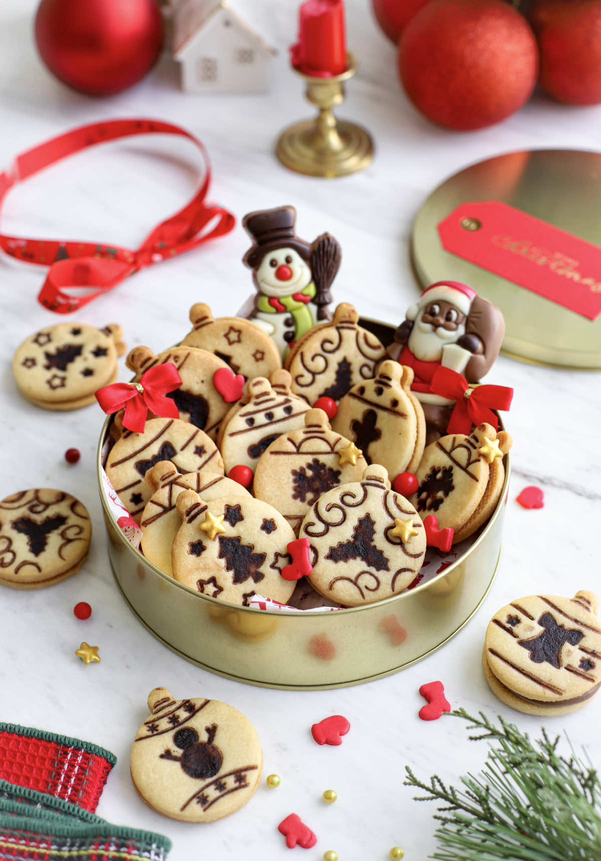 Sandwich cookies with Nutella  Ingredients •1/2 cup + 6 tbsp salted butter softened •1 cup powdered sugar •1 egg plus 1 egg yolk •2 tsp pure vanilla extract •¾ cup finely ground almond flour •2 cups all purpose flour •½ teaspoon baking powder •½ teaspoon kosher salt •1 ½ cups Nutella Hazelnut Spread Instructions 1.Cream together softened butter and powdered sugar in a large bowl. Add egg, egg yolk, and vanilla extract, mixing until smooth. 2.Stir in almond flour, all-purpose flour, baking powder, and salt until a soft, slightly sticky dough forms. 3.Wrap the dough in plastic wrap and chill for 45 minutes. 4.Preheat oven to 350°F. Roll out dough to 1/4-inch thickness on a floured surface. Cut out 2-inch circles.  5.For the top cookies, choose any cookie cutter with a design you like. Dip the cutter into cocoa powder, then gently press it onto the tops of the cookies to create an embossed design. Be sure to shake off the excess cocoa  before pressing to achieve a clean, crisp finish. 6.Place cookies on a parchment-lined baking sheet. 7.Bake for 13-14 minutes until edges are golden. Cool completely. 8.Spread Nutella on the cookies, then top with the cookies with stamp.