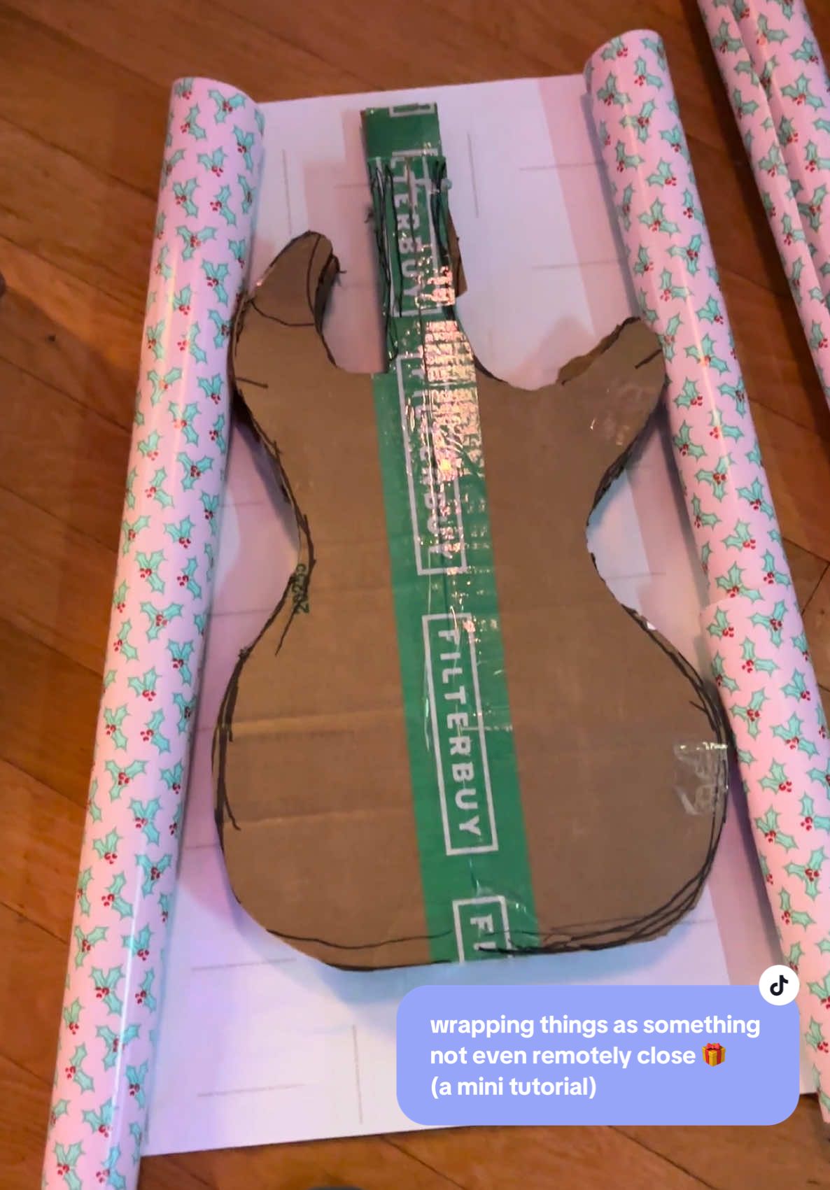 Replying to @alexa  back again but with a guitar! LOL #wrappingthingsthatarentwhattheyare #wrappingpresentsassomethingdiffrent #wrappingtutorial #wrappingpresents #wrappinggiftsassomethingnotremotelyclose 