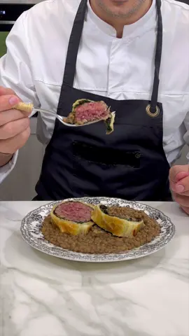 Want to know the Italian traditional dish for New Year's eve? Cotechino in crosta! (pork in a crust) 🧡😍 @sebastian_fitarau Ingredients: Puff pastry 8 oz (230 g) Precooked cotechino 1 lb (500 g) Lentils ⅔ cup (150 g) Carrots 1 Onions 1 Celery 1 rib Rosemary 2 sprigs Extra virgin olive oil 2 tbsp Butter 1 spoonful Fine salt to taste Black pepper to taste Vegetable broth to taste For brushing the pastry Heavy cream to taste Egg yolks 1 #giallozafferano #giallolovesitaly #cotechino #Holidays #crust