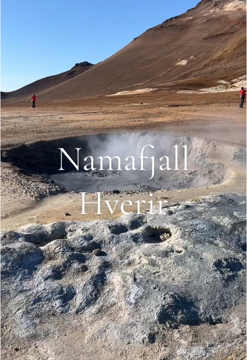 The Namafjall Hverir Geothermal Mud Pools are a must-visit! This was such a unique experience and I think we had too much fun here 🤭 Just be mindful that there is an unpleasant, sulfuric smell that surrounds the place due to the volcanic activity beneath the surface. Other than that, the landscape, the bubbling mud pools and the natural steam vents were surreal! There were many different mud pools, some boiling more than others, but I think the steam vents were our favorite part. There is one covered in rocks so you can get close to it, and because it was so cold out, the heat from the steam was so pleasant (except the smell, of course). We were using it to warm our hands while taking in the uniqueness of something so surreal as steam coming from lava directly below us! The landscape makes you feel like you’re visiting mars with all the different colors of dirt, from gray to red to white to brown. It was incredible!  #iceland #icelandadventure #bucketlist #travelbucketlist #naturelovers #naturephotography #beautifuliceland #traveltiktok #travel #adventure #NamafjallHverirGeothermalMudPools #NamafjallHverir #GeothermalMudPools 
