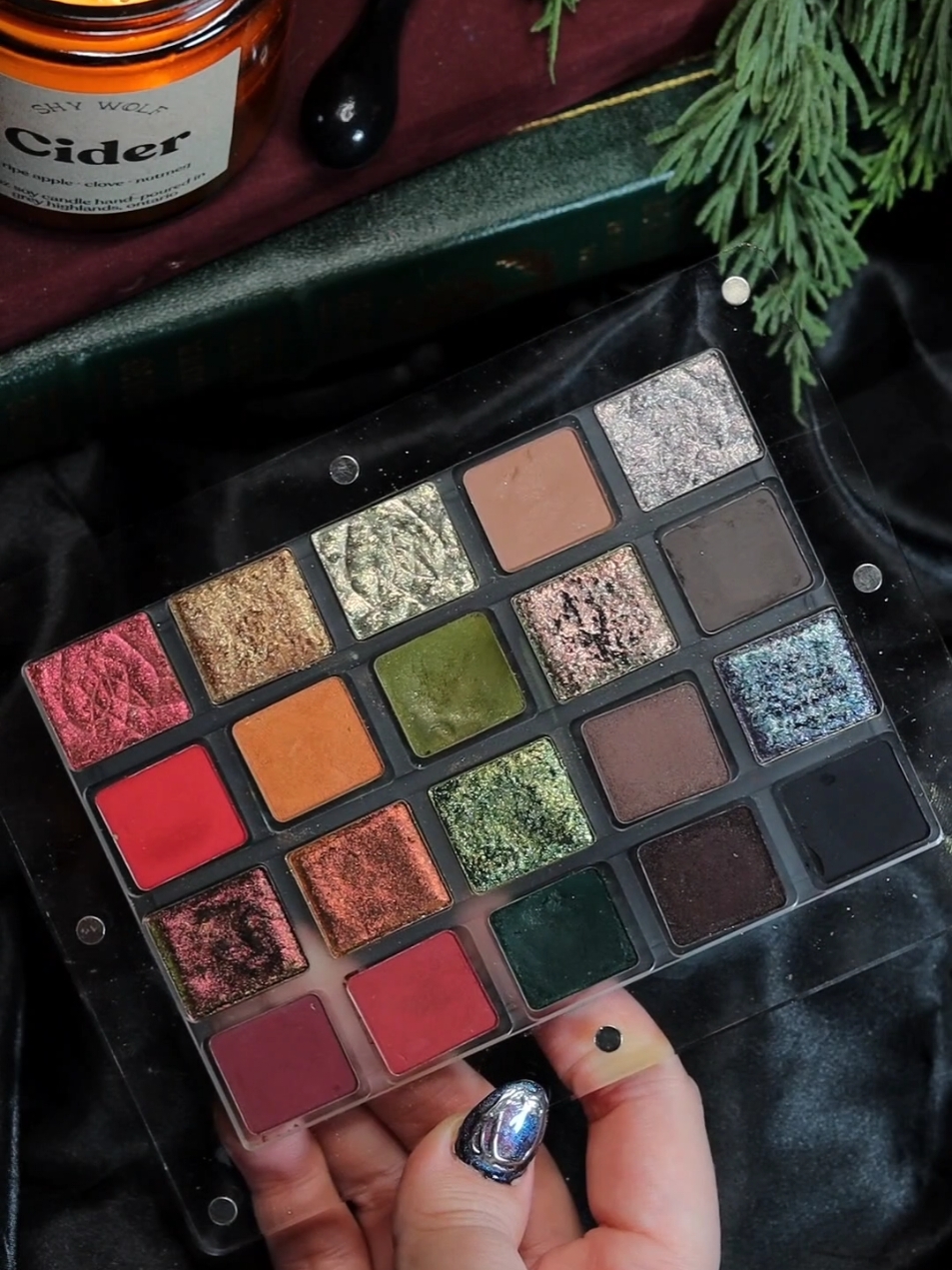 🌲🕯 Dark Holiday Palette 🕯🌲 I have another custom palette to share with you guys today! It's a mix of @clionadhcosmetics and @natashadenona shades. I have a post specific shade names up on my Instagram if you're interested.  Empty magnetic palette is by @krypteincosmetics  *Some of these shades were received in PR* #darkholiday #darkyule #holidaymakeup #clionadhcosmetics #clionadhstainedglass #natashadenonamakeup #byop #multichromemakeup 