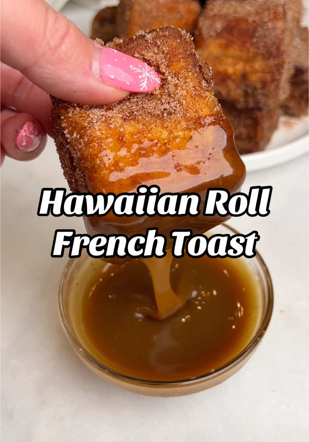 Let’s make Hawaiian Roll French Toast that’s stuffed with a creamy cheesecake filling, rolled in cinnamon sugar and served up with caramel sauce for dipping. These are easy to make for a crowd and perfect for your Christmas brunch spread! #frenchtoast #hawaiianrollfrenchtoast #stuffedfrenchtoast #christmasbreakfast #holidayrecipe #christmasbrunch 