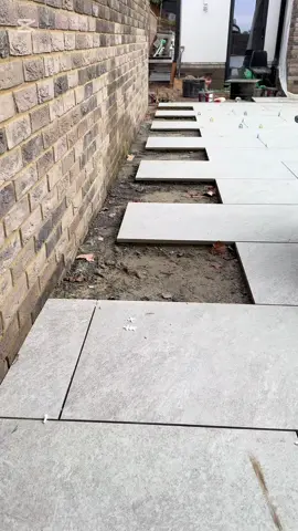 How to lay porcelain tiles…keep watching 👍🏼 #construction #landscape #work #contentcreator #views #house #fyp #fypシ゚viral🖤tiktok #albania #shqiptaretneperbote🇦🇱🌍 #satisfyingvideo #groundwork #balkan #landscaping #garden #tiles #porcelain #cuts #drainage 
