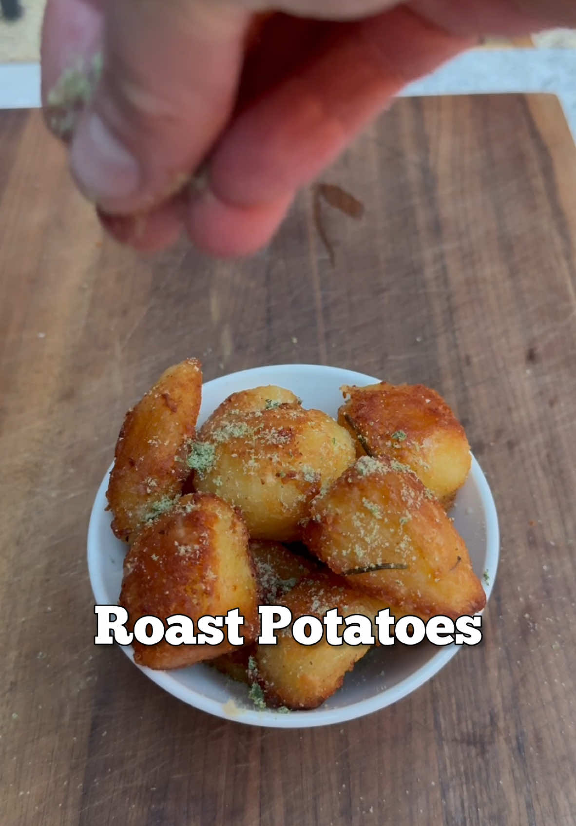 Merry Christmas, here’s some roast potatoes.  Method works the same for a veggie/vegan version This recipe is really a method rather than a volume but I made enough roasties for 2 in this video but below is a method for 4 hungry potato monsters  1kg Maris piper potatoes Chicken/Beef/Veg Stock or a stock cube Rosemary Garlic  Thyme Salt  Sea salt Beef fat / duck fat / Veg oil 1. Peel your potatoes and keep the peeling for something else - they can be frozen. Cut evenly into fairly chunky pieces. 2. Wash in cold water then add to pan of cold stock add some salt. Bring this gently to a boil then reduce to a simmer for around 20 mins. Save the stock to make gravy 3. The potatoes should be cooked and delicate around the edges remove them rough them up then place on a rack to dry. For even crispier potatoes do this a day in advance and keep them in a fridge uncovered 4. Infuse the chosen fat with garlic and rosemary over a low heat for 30 mins 5. Strain the fat in an oven tray and heat to 220c careful add the potatoes to the hot fat coating well.  6. Roast for 45 mins turning every 5-10 mins 7. Use a blender or mortar and pestle to grind equal parts sea salt and rosemary for a nice seasoning  8. Drain off the fat for the final 5 mins of cooking and save this for another day  9. Serve piping hot and super crispy  #potato #chefrecipes 