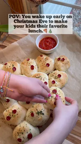 Christmas Tree Pepperoni Rolls 🎄🍕 These were gone in minutes. My girls love them!! I did hear them say “save 2 for dad!” ♥️☺️ RECIPE - Makes 16 rolls  INGREDIENTS: 16 Rhodes Dinner Rolls  16 slices of pepperoni 3 mozzarella cheese sticks 2 Tbsp butter  1 tsp minced garlic  1/2 tsp dried parsley  32 mini pepperonis  avocado oil spray  DIRECTIONS: 1. Grease two 9x13” baking dishes with cooking spray.  2. Divide the rolls amongst each pan, spreading them apart.  3. Spray the rolls with cooking spray, cover tightly with plastic wrap and place in a warm location. *I placed mine in my office since it’s the toastiest room in the house.  4. Let them rise for a few hours. *Mine took 4 hours.  5. Cut the cheese sticks into small chunks. 6. Pull the plastic wrap back and then spread a roll out with your hands.  7. Fill it with 1 chunk of cheese and 1 slice of pepperoni.  8. Close the roll making sure to completely cover the cheese and pepperoni.  9. Place the sealed side down into the pan.  10. Repeat with remaining rolls.  11. Cover with the wrap and place in a warm location to rise again. *This takes about 2 more hours.  12. Preheat oven to 350 degrees F.  13. Line a large baking sheet with parchment paper.  14. Place the rolls onto the sheet in a tree shape. I used one roll for the trunk, 5 for the bottom row, 4 for the second row, 3 for the third row, 2 for the fourth row and 1 for the top.  15. Melt the butter in a bowl and stir in the parsley and garlic.  16. Brush the garlic butter all over the rolls and then top each one with 2 mini pepperonis.  17. Bake for 15 minutes and then enjoy!!  #pepperonirolls #pepperoni #rolls #lunch #kids #food #pizza #snack #christmas #christmaseve #mom #cooking #reels #kristyslifestyle 