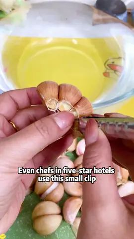 # Peel garlic with this stainless steel # garlic peeling tongs. I used to peel garlic by hand and it hurt my hands. Now with this garlic peeling tongs, peeling garlic saves time and effort # Tips for peeling garlic # Peel garlic # Kitchen goodies