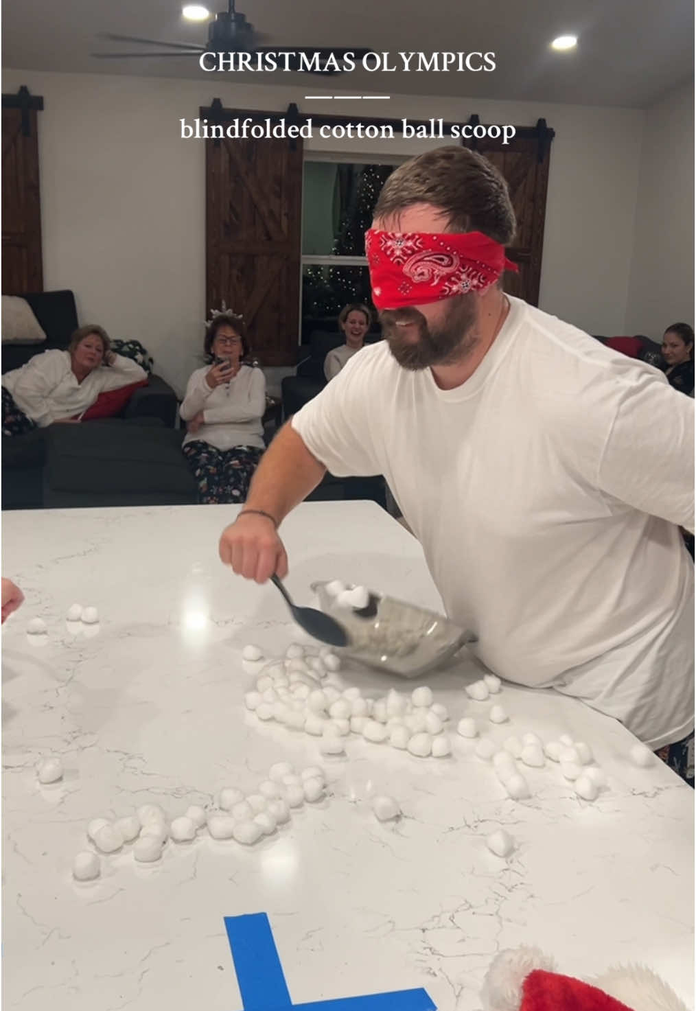 I thought I was doing great and only got 4 😂🎁🤍🎄🎅🏼 #chistmas #olympics #games #blindfolded #cottonball #scoop #funny #family 