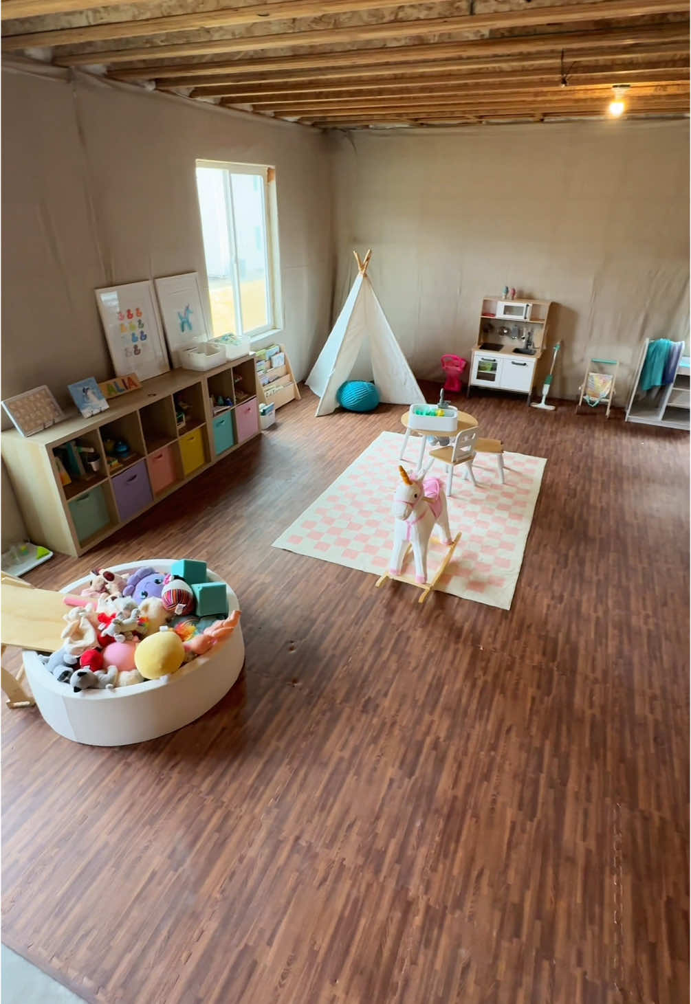 So much more space for them! Everything is temporary until we’re ready to finish it! Love @Lovevery  #lovevery #loveverygift #playroom #unfinishedbasement #toyrotation #basementplayroom #toddlermom #MomsofTikTok #latinacontentcreator #mexicana #foryourpages 