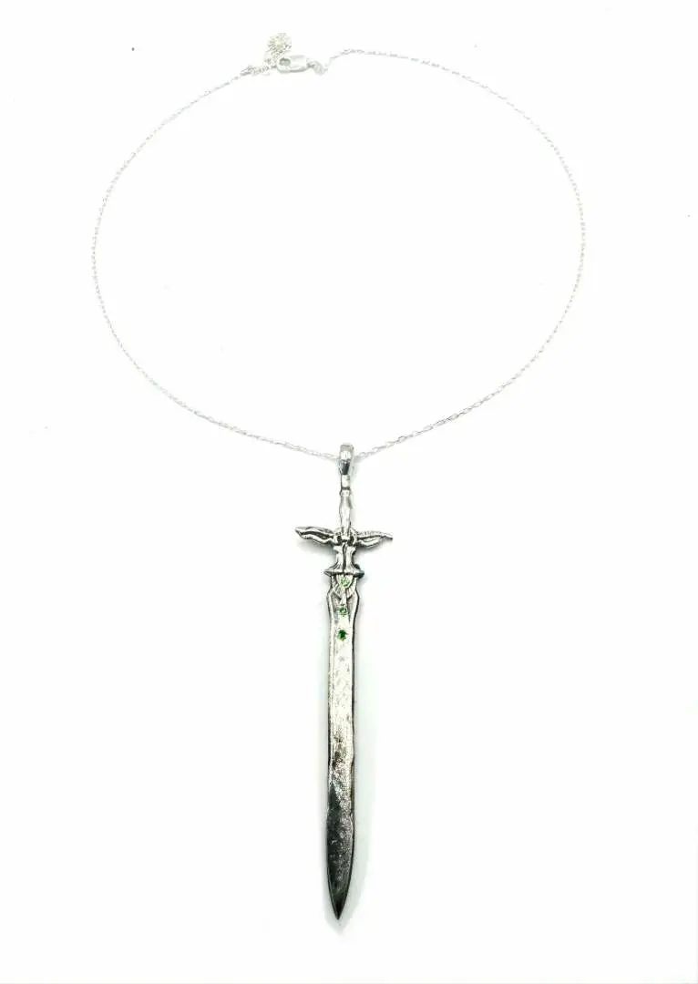 Bold, brutal, and beautiful – uncover what’s been hidden in the shadows. Sword of the Ancients Sword Necklace with Tsavorite Garnets in Sterling Silver https://julianthe2nd.com/products/sword-of-the-ancients-sword-necklace-in-sterling-silver-or-bronze # #Punk #Aesthetic #Punkfashion #DarkJewelry #Unique #Finds #Custom #Pieces #Edgy