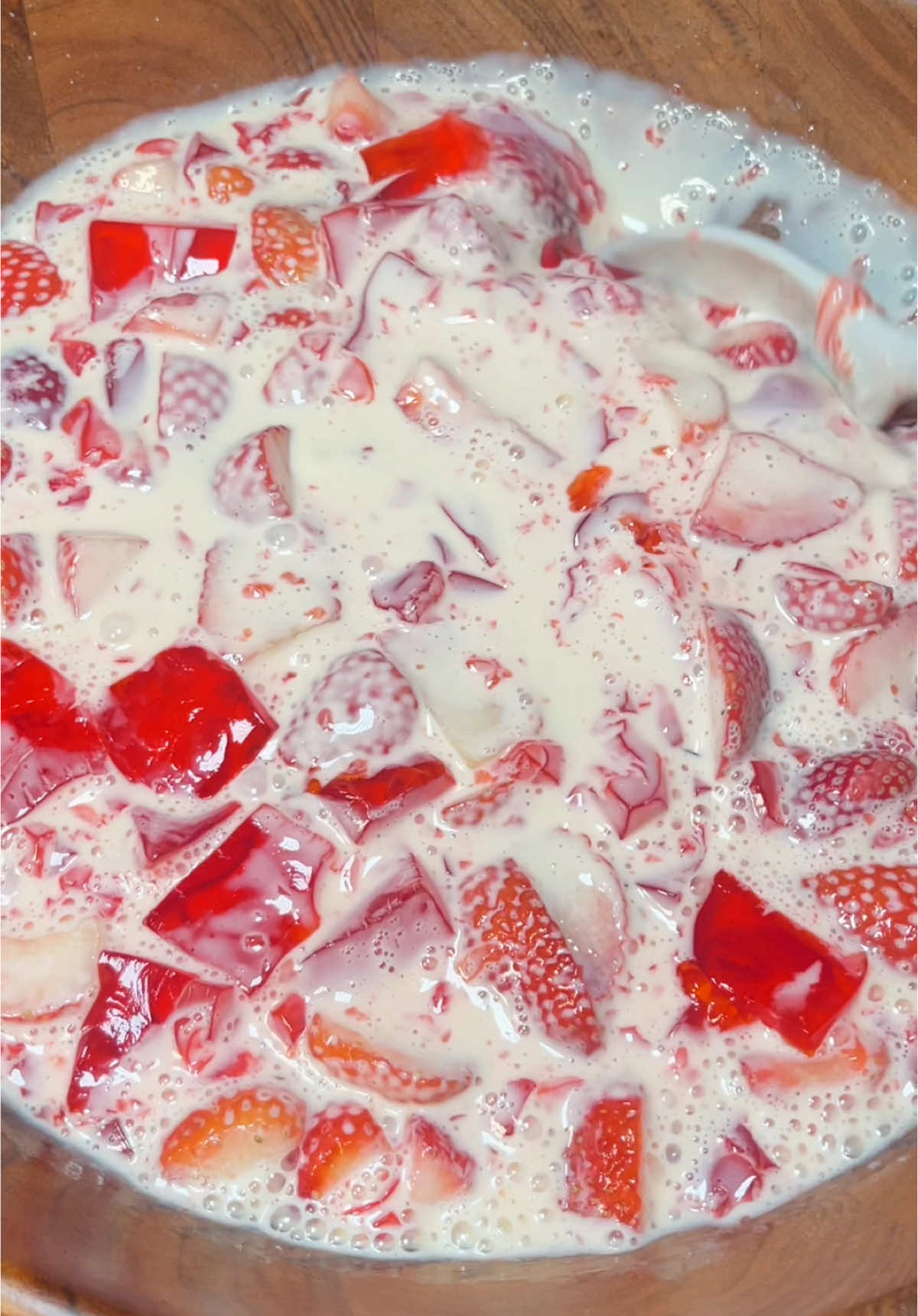 Strawberries and cream With jello cubes🍓🥛🎀 RECIPE BELOW!! 👇🏻  Ingredients  - strawberry gelatin (3oz box or more)  - 1 pound Strawberry’s, halved or quartered  - 1-2 tablespoons sugar  - 1 can evaporated milk (12oz) - 1 can Table cream (also known as Media Crema) (7.6 oz) - 1 can condensed milk (14oz) - 3 tablespoons Sour cream  Start by making strawberry jello per the instructions. Pour it into a dish and scoop out as much of the foam bubbles as you can. Store it in the fridge or freezer depending on how fast you need it done.  Wash and clean about a pound of strawberry’s. Half or quarter them depending on the size.  Add them to a bowl and macerate them by adding one tablespoon of sugar. This process will enhance the strawberries flavor by drawing out their natural juices and slightly softening them  In a separate bowl add in the evaporated milk, table cream, sweetened condensed milk, sour cream, and vanilla extract.  Once the jello sets, cube it and added it to a bowl with the strawberry’s. Finally pour the liquid mixture into the bowl. Chill it in the fridge until you are ready to serve. The longer you let it sit the better it will taste and the pinker it will get! If you want to add more flavor and texture top with pecans.  ————————————————#strawberries #strawberryshortcake  #strawberriesandcream #fresasconcrema #fresasconcremaygelatina #latinacontentcreator #fortworthcontentcreator #dallascontentcreator #EasyRecipe #dessert #easydessert #mexicandessert #recetasfaciles #strawberrydessert #cream #foodcontentcreator #foodcreator #foodtiktok #sweetenedcondensedmilk #lechecondensada #evaporatedmilk #mediacrema #tablecream #hosting #hostingdessert #strawberryshortcakerecipe 