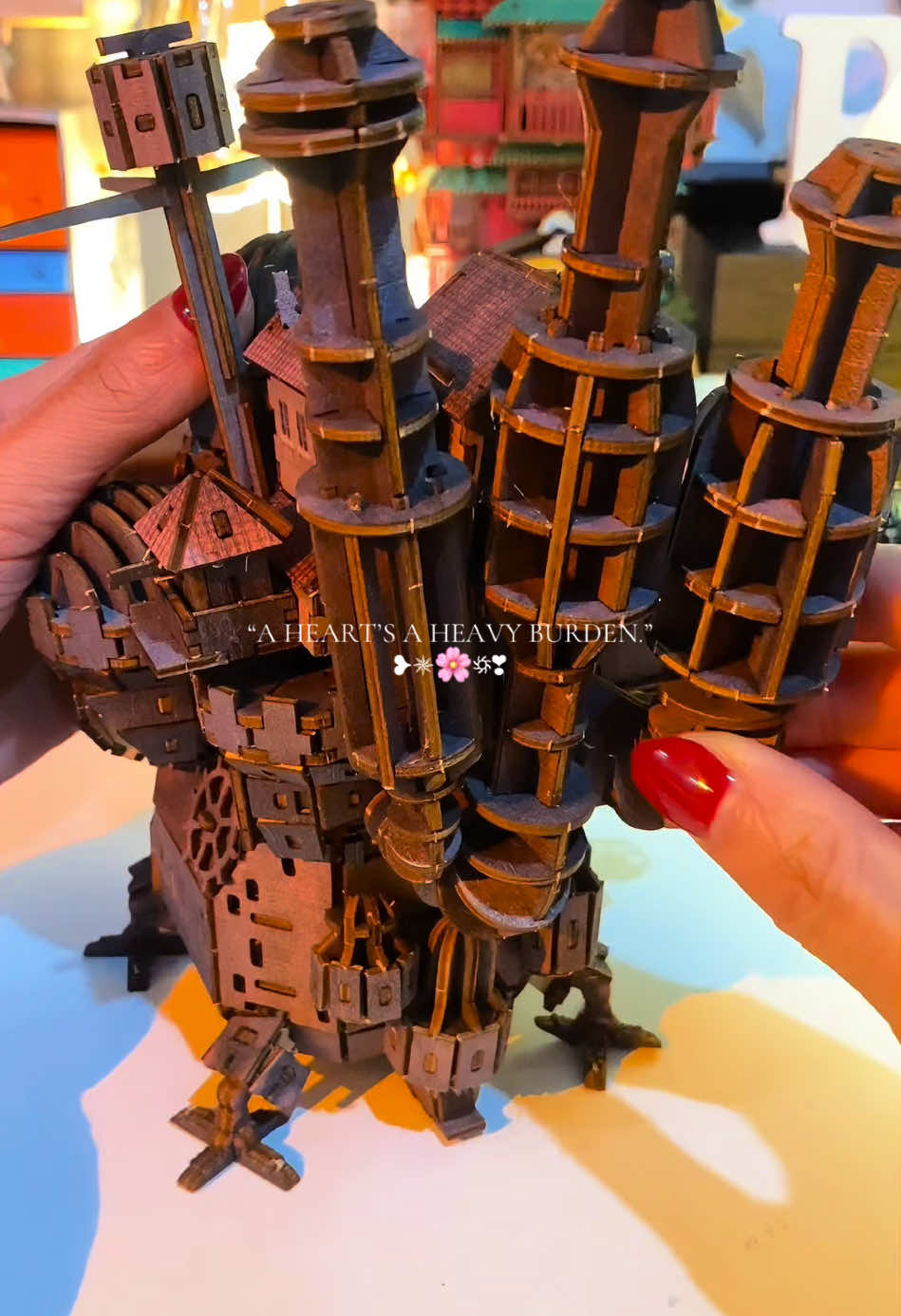 🌟“𝐓𝐡𝐞𝐲 𝐬𝐚𝐲 𝐚 𝐡𝐞𝐚𝐫𝐭 𝐢𝐬 𝐚 𝐡𝐞𝐚𝐯𝐲 𝐛𝐮𝐫𝐝𝐞𝐧, 𝐛𝐮𝐭 𝐛𝐫𝐢𝐧𝐠𝐢𝐧𝐠 𝐭𝐡𝐢𝐬 𝐜𝐚𝐬𝐭𝐥𝐞 𝐭𝐨 𝐥𝐢𝐟𝐞 𝐰𝐚𝐬 𝐚𝐧 𝐮𝐧𝐟𝐨𝐫𝐭𝐚𝐛𝐥𝐞 𝐣𝐨𝐮𝐫𝐧𝐞𝐲.“✫彡 Over five nights, i poured my energy into recreating the iconic castle of Howl’s. Every detail is a heartfelt tribute to the enchanting world that has inspired so many. 🤍 But let me warn you-this project is not a easy one. It’s a challenging endeavor that requires patience, focus. If you are up for the challenge, the reward is a magical piece that feels straight out of a Studio Ghibli dream. 🍃💐 𝐉𝐢𝐨𝐧 𝐦𝐞 𝐢𝐧 𝐜𝐞𝐥𝐞𝐛𝐫𝐚𝐭𝐢𝐧𝐠 𝐜𝐫𝐞𝐚𝐭𝐢𝐯𝐢𝐭𝐲, 𝐝𝐞𝐭𝐞𝐫𝐦𝐚𝐭𝐢𝐨𝐧 𝐚𝐧𝐝 𝐭𝐡𝐞 𝐭𝐢𝐦𝐞𝐥𝐞𝐬𝐬 𝐜𝐡𝐚𝐫𝐦 𝐨𝐟 𝐇𝐨𝐰𝐥’𝐬 𝐌𝐨𝐯𝐢𝐧𝐠 𝐂𝐚𝐬𝐭𝐥𝐞. ✨🏰 #miniaturediy #miniaturediykit #bookshelfdecor #howlsmovingcastle #howls #ghibli #ghiblistudios #studioghibli #diychallenge #nooksden #craftingtiktok #miniaturebuilds #diyproject #diyprojectsideas #giftidea #fyp  @Nooks’ Den📚 