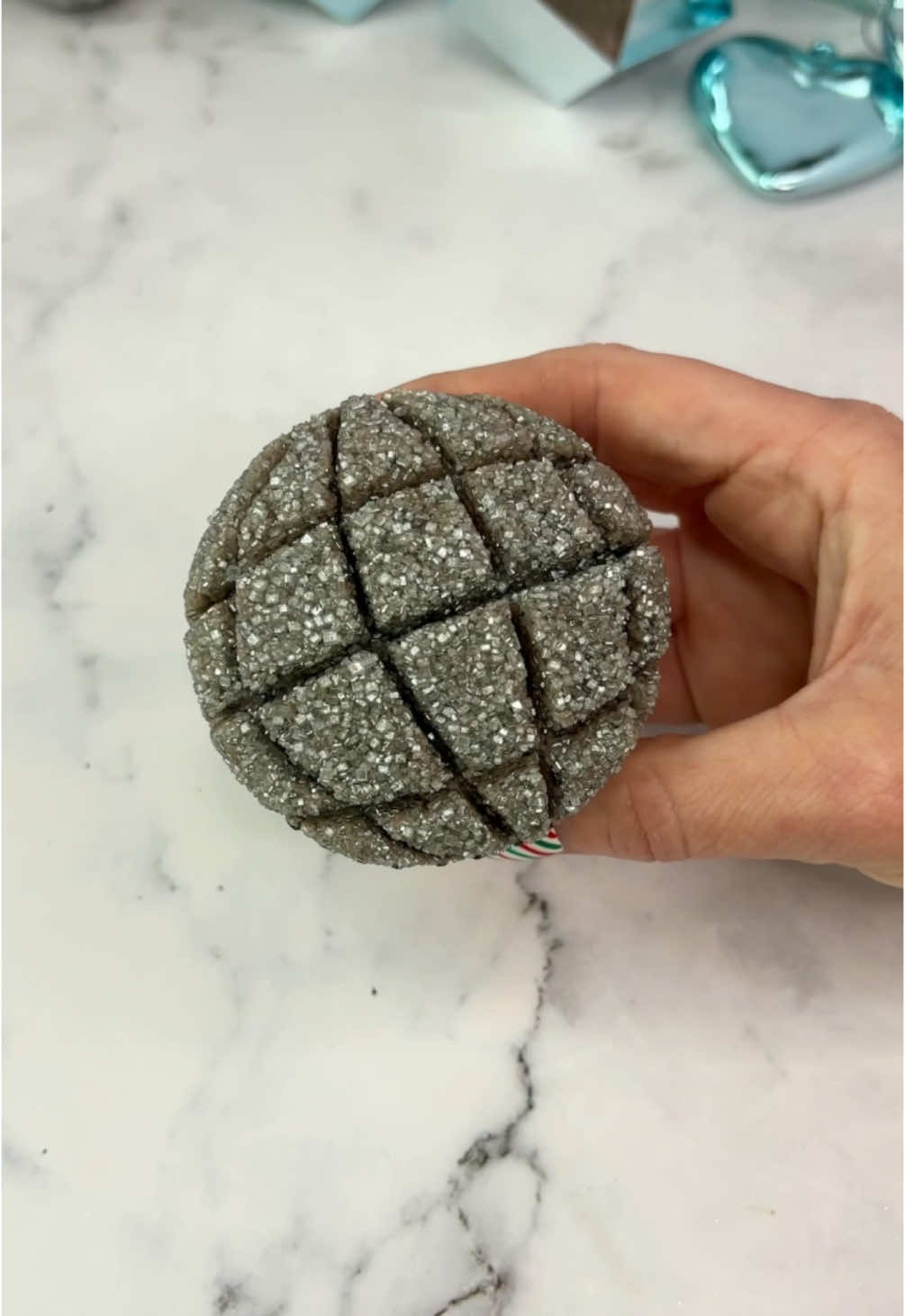 Shiny disco balls 🪩 So fun and sparkly 🪩 perfect for any occasion 🪩✨  🪩 Pipe a swirl of grey buttercream onto your cupcakes. 🪩 Press into silver sanding sugar. 🪩 Use a wooden skewer to make lines in the buttercream. Press the skewer into the buttercream to make an indent. Wipe the skewer with a tissue and continue with the next line.  #cupcake #cakeart #discoball#cakedecorating #happynewyear#cakedbyrach #cupcakeartist#cupcakesforanyoccasion