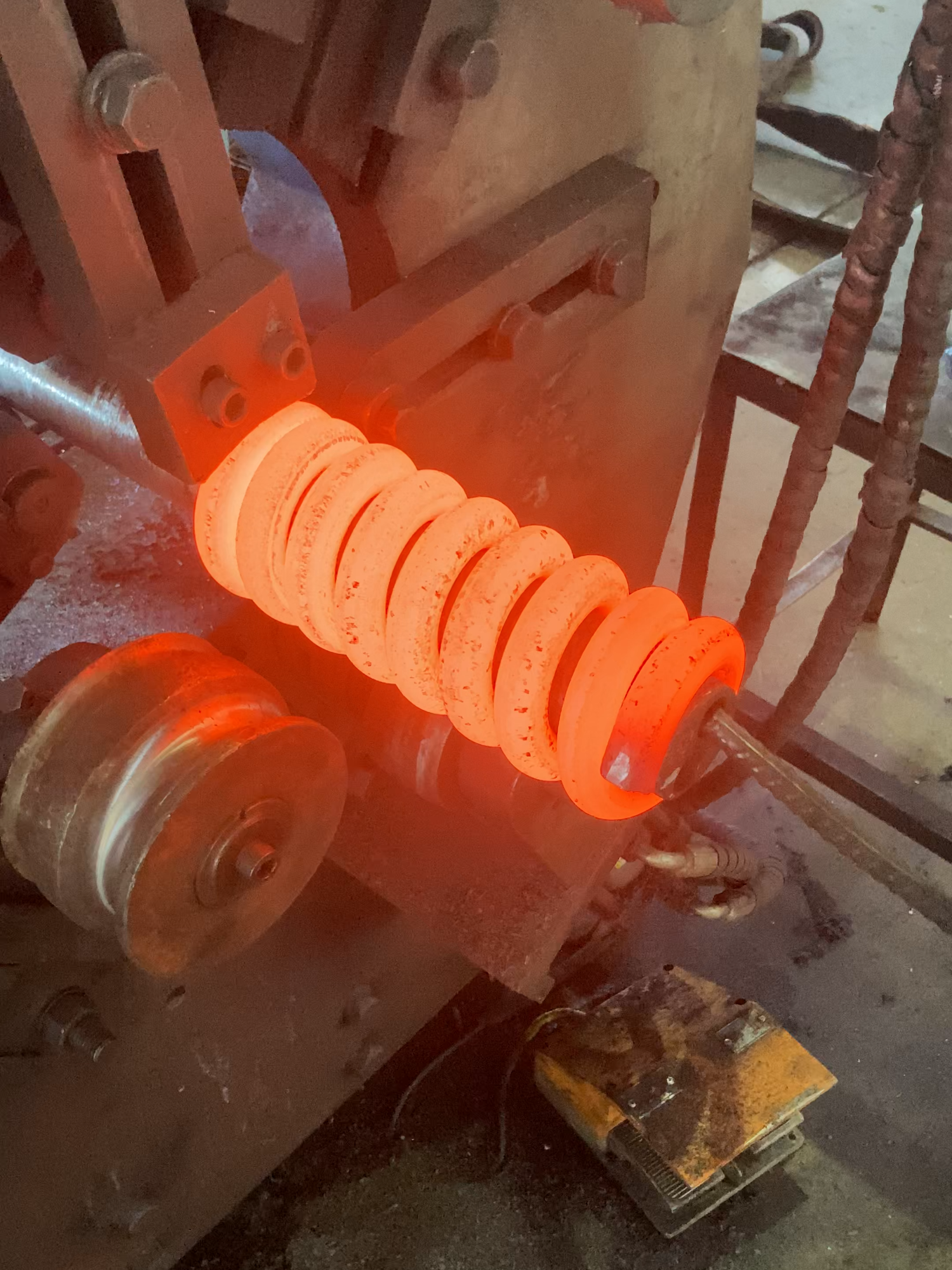 The process of heating and making a huge springs for train's wheel system #machine #factory #process #manufacture #producer #manufacturing #springs #industry #tech