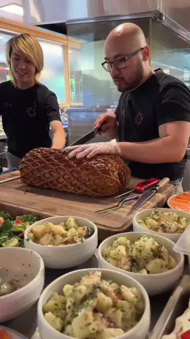 My Biggest and Best Beef Wellington Yet! [Part 2 of 2] Cooked this up for our @kingclarence_sydney staff #Christmas lunch. The team at KC are the best hype people out there! What an awesome crowd to crack this open to 🤣  For this Welly, I used a whole scotch fillet, also known as cube roll or ribeye from @oconnorbeef , a stunning cut of pasture-raised beef with a marble score in of 2-4.  The first step was to carefully trim the beef, removing any excess fat and silver skin, ensuring a perfect base for what was to come. Next, the beef was generously seasoned, rolled up, and chilled in the fridge. This step not only helped it hold its shape but also allowed the salt to deeply penetrate the meat. Once ready, I oiled the beef and grilled it over a bed of ironbark and charcoal, giving it a beautiful smoky sear. After grilling, I massaged it with a generous layer of Dijon mustard, rolled it up again, and left it overnight to let the flavours further develop. The day before cooking, I prepared a chunky duxelle, combining mushrooms, onions, garlic, thyme, whiskey, white wine, loads of black pepper and our house made porcini mushroom sauce. This savoury mushroom mix was then folded into a silky smooth mousse made from blended chicken breast. The beef was then encased in delicate beef bresaola and a couple of layers of this huge spinach crepe, made by our talented pastry team (shoutout to @_saaya.t !) After that, it was rolled once more and chilled in the coolroom overnight to let everything take shape and come together. On the big day, the Wellington was wrapped in nearly 2kgs of buttery puff pastry, studded with sprigs of rosemary and thyme. After an egg wash, it went into the oven, where it baked for nearly 3 hours, with an additional hour of resting time to let the juices settle. By the end, this beast weighed in at almost 10kg—maybe even more, but our scales couldn’t quite handle it. It was huge!  While I would’ve loved to let it rest for another 30 minutes to perfect the texture, the show had to go on—everyone was hungry and ready to dig in, and to my surprised it was all polished up by the team, what an effort.  #beef #wellington 