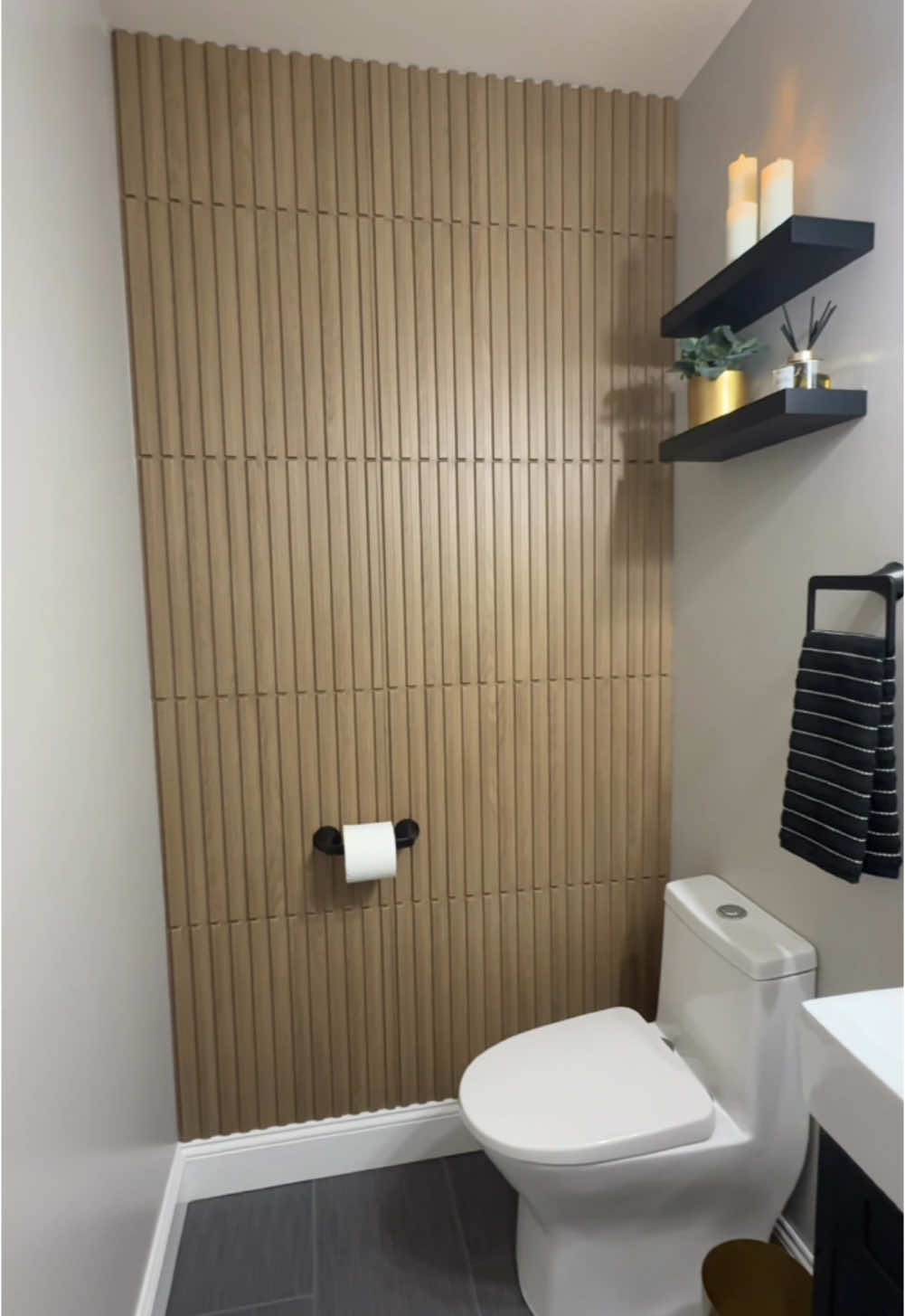 Click orange cart for link. I can’t get enough of these @Art3d 3D slat wall panels. Not only were they super easy to install, they are lightweight and easy to cut! You can use liquid nails or heavy duty tape to install.  I love the instant upgrade and modern look! The wood grain look adds warmth and style and the PVC material is perfect for this space because it is moisture resistant and easy to clean!  These panels are 19.7 x 19.7”, come in a pack of 12 and are available in 3 color options to suit any space.  @art3d_llc is seeking UGC influencers for collaborations. #art3ddecor #wallpanels #3dwallpanels #pvcwallpanels #walnutwallpanels #slatwallpanels #bathroomremodel #powderroom #powderroommakeover