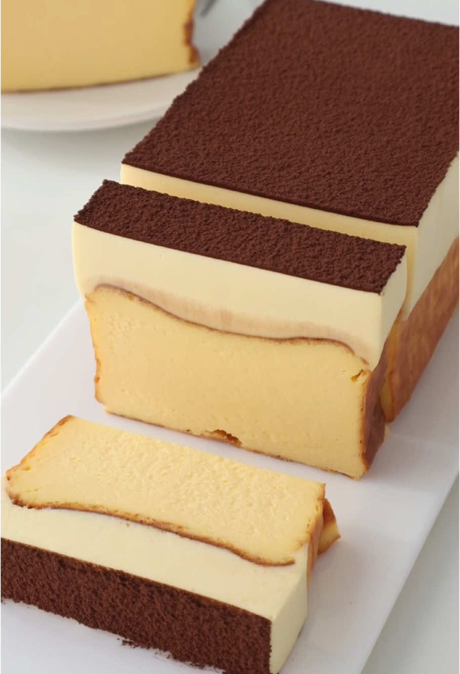 Tiramisu Basque 🍰🍰 📝Basque cheesecake: - Cream cheese 300g - 70g fine sugar - 3 whole eggs - 150g light cream - Corn starch 13g 📝Tiramisu layer: - 1 egg yolk that can be eaten raw - 30g fine sugar - Mascarpone cheese 110g - 160g light cream - Milk 30g - Gelatine tablets 5g
