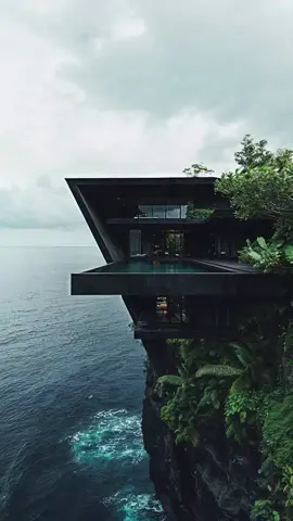 An exclusive Bali retreat for those who love dark, bold designs. Concept by @matitectura using Midjourney.  @interior_home_design1  #midjourney #ai #aiartcommunity #luxury #travel  #architecture #concept #aiart #ai #aiart #Home #mansion #bali #dezeen #designboom #architecturemagazine  #archilovers #architecturephotography #bali #house 