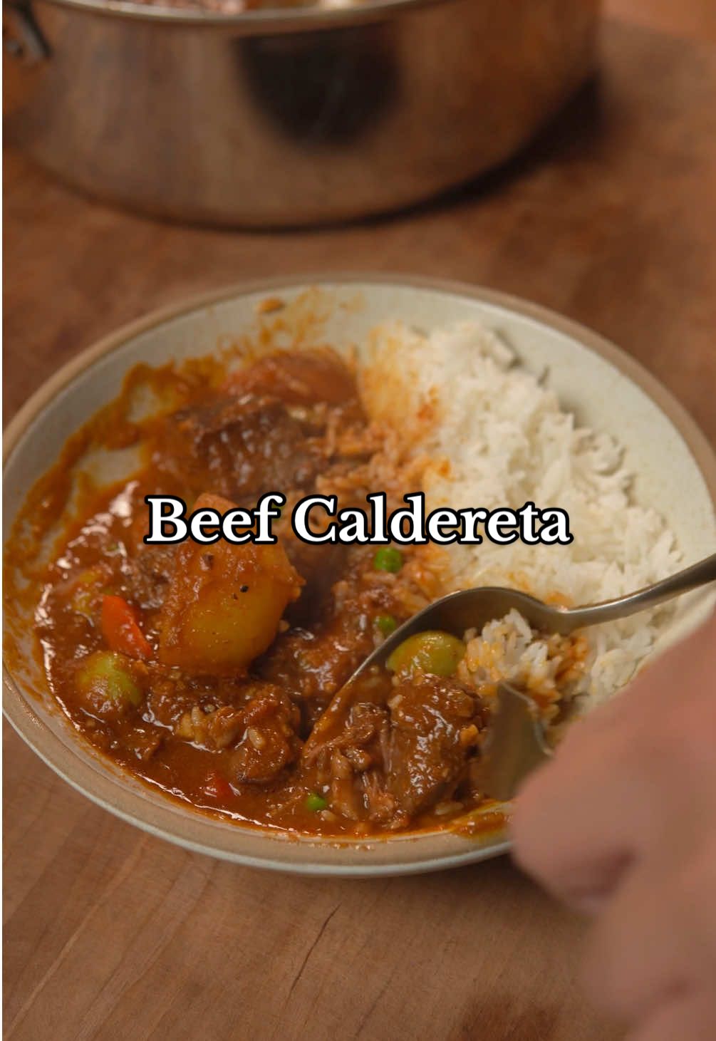Beef Caldereta Ingredients * 2 carrots(peeled and cut into chunks) * 3 white potatoes(peeled and cut into chunks) * 1 onion(minced) * 6 cloves garlic(minced) * 2 bell peppers(cut into chunks) * 2.5 lbs beef chuck(cut into bite-sized pieces) * Salt and pepper to taste * Neutral oil * 2 tbsp tomato paste * 85 grams liver spread(1 can) * 14 oz crushed tomatoes * 2 bay leaves * 2 cups beef stock * 1 tbsp fish sauce * 1 tbsp soy sauce * 1 tbsp oyster sauce * 2 tbsp sugar * 3 thai chilies(halved) * 1/2 cup green olives(pitted) * 1/3 cup frozen peas Instructions 1. Prep all veggies and slice beef into bite-sized pieces making sure to season generously with salt and pepper. 2. Heat heavy pot with 3 tbsp of neutral oil on high heat and sear beef in batches so all sides or browned. 3. Remove beef, reduce the heat to medium, and sauté onions and garlic in the same pot making sure to scrape any bits left on the pan. 4. Add tomato paste and cook for a few minutes before adding liver spread and crushed tomatoes. Mix until fully incorporated. 5. Add back the beef along with bay leaves and cover with beef stock. Season with fish sauce, soy sauce, oyster sauce, sugar, and Thai chillies. 6. Bring to a simmer, and cook low and slow for 3-4 hours with the lid on until the beef is tender. 7. Deep fry carrots and potatoes at 350F for 4-5 minutes until browned. 8. Add fried carrots and potatoes, bell peppers, and green olives in the last 20 minutes of cooking or until the potatoes are fully cooked through. 9. Add frozen peas at the end and once its warmed through, serve the Caldereta with hot rice and enjoy. #lowandslow #filipino #filipinofood #kaldereta #caldereta #beefcaldereta #beefkaldereta #filipinocaldereta #beef #stew #beefstew #food #cooking #Recipe #comfortfood #recipevideo #cookingvideo #cookingtutorial #recipetutorial 