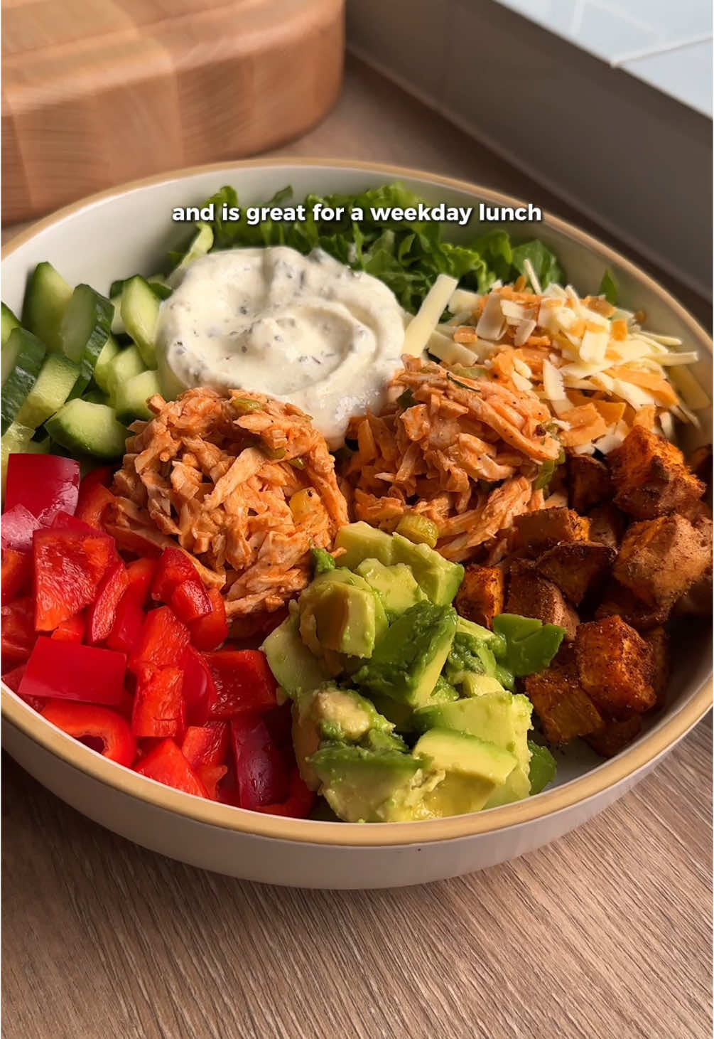 30 DAYS OF BALANCED BOWL RECIPES 🥣 DAY 5 🥗 Buffalo Chicken Salad Bowl Macros: 561 cals / 51g P, 27g C, 24g F This healthy, high protein salad bowl is one you need to try out! 🤤 the buffalo chicken mix is so easy & it’s great for meal prep lunches, with over 50g of protein too! 🔸 Buffalo Chicken Ingredients: 1 cooked chicken breast  3tbsp buffalo sauce 1tbsp light mayonnaise  Black pepper 1 small spring onion, sliced  🔸 Lemon & Garlic Yogurt Ingredients: 20g Greek yogurt 0.5tsp garlic granules  1tsp oregano Squeeze of lemon juice 🔸 Salad Bowl Ingredients: 100g sweet potato, cubed 1tsp paprika & 0.5tsp garlic granules 1 cup shredded romaine lettuce 50g chopped cucumber 60g chopped red bell pepper 65g chopped avocado 15g grated reduced fat cheese Method: 1. Spray the sweet potato cubes with a little oil & mix with the smoked paprika & 0.5tsp garlic granules. Then air fry for 10-12mins or till cooked through  2. Meanwhile, shred the cooked chicken breast & mix with the light mayonnaise buffalo sauce, some black pepper & sliced spring onion & set aside (serve this hot or cold depending on your preference)  3. In a small bowl mix all the lemon & garlic yogurt ingredients till smooth & set aside  4. Chop all the salad bowl ingredients ready to put in the bowl 5. Assemble all the salad bowl ingredients in a large bowl & enjoy!  #buffalochicken #chickensalad #saladbowl #saladrecipe #highproteinmeals #worklunch #mealprepideas 
