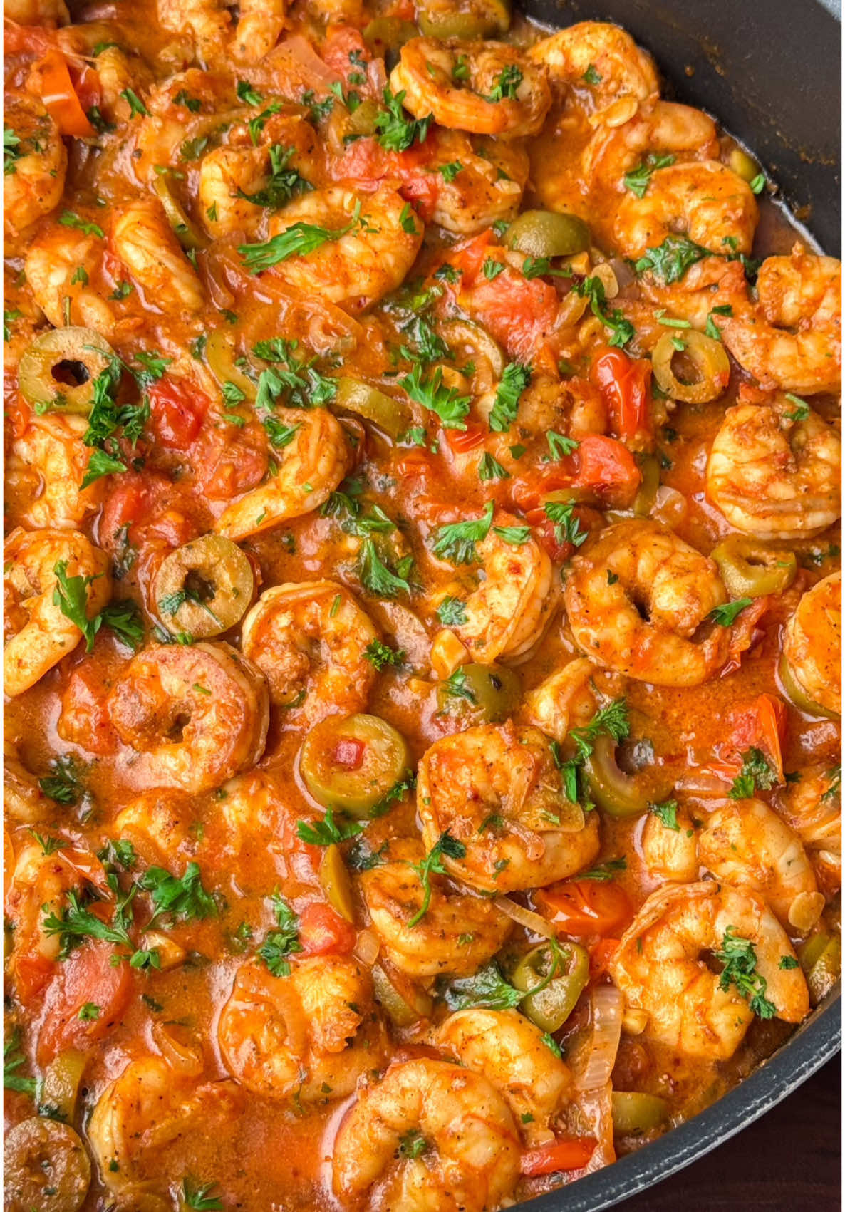 One Pan Seared Shrimp In a Garlic, Tomato Olive Sauce  It’s quick, easy, and packed with flavor!  The best part? You only need one pan! Start by searing the shrimp until they're perfectly golden. The aroma of garlic will fill your kitchen, making it hard to resist. Next, add juicy tomatoes and olives to create a vibrant sauce. Let everything simmer together for a few minutes; the flavors meld beautifully! Serve it over rice, pasta or with crusty bread to soak up that delicious sauce. —Ingredients— 2 pounds raw shrimp 1.5 teaspoon salt (all together, 1 for shrimp and 1/2 for sauce) 1 teaspoon garlic powder  1 teaspoon paprika  1 teaspoon oregano  1.5 teaspoon black pepper (all together, 1 for shrimp and 1/2 for sauce) 1/4 cup extra virgin olive oil  2 tablespoons butter  1 large shallot sliced  5 cloves garlic sliced  1 pound cherry tomatoes halved  1 cup green pitted olives sliced (or Kalamata olives)  1/2 teaspoon chili flakes or to taste  The zest of 1 lemon  The juice of half a lemon  1/2 cup chopped parsley (reserve a little for garnish)  1. Clean, devein the shrimp and place in a large bowl then pat dry with paper towel.  2. Season the shrimp with 1 teaspoon each salt, garlic powder, paprika, oregano and black pepper.  3. Place a large pan on medium-high heat. Add olive oil then the shrimp in 2 batches. Cook the shrimp for 1-2 minutes per side until pink and remove from pan.  4. To that same pan add in the butter, the shallots and garlic. Sauté for about 2 minutes until fragrant. Next add in the tomatoes and olives, stir and cook for about 5 minutes until the tomatoes are softened and release some of their juices.  5. Season the tomato mixture with 1/2 teaspoon each salt, black pepper, chili flakes, the zest of one lemon and juice of half a lemon, Stir again!  6. Return the cooked shrimp back to the pan with all the juices and add the chopped parsley. Give everything a good toss and simmer for about 4-5 minutes until the shrimp are heated through.  7. Garnish with more parsley when serving. Serve over rice, pasta or with some crunchy bread and enjoy!  #DinnerIdeas #onepanmeal #EasyRecipe #shrimpdish #homecooking #fresh #delicious #tasty #Love #cookwithme #costco #comforting #deliciousfood #foodtiktok 