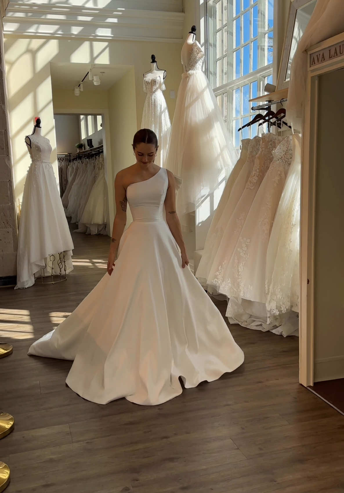 Clean and classic combines with bold drama in this stretch mikado aline! From her one-shoulder neckline to her detachable bow-which detail do you love the most? GOWN - 