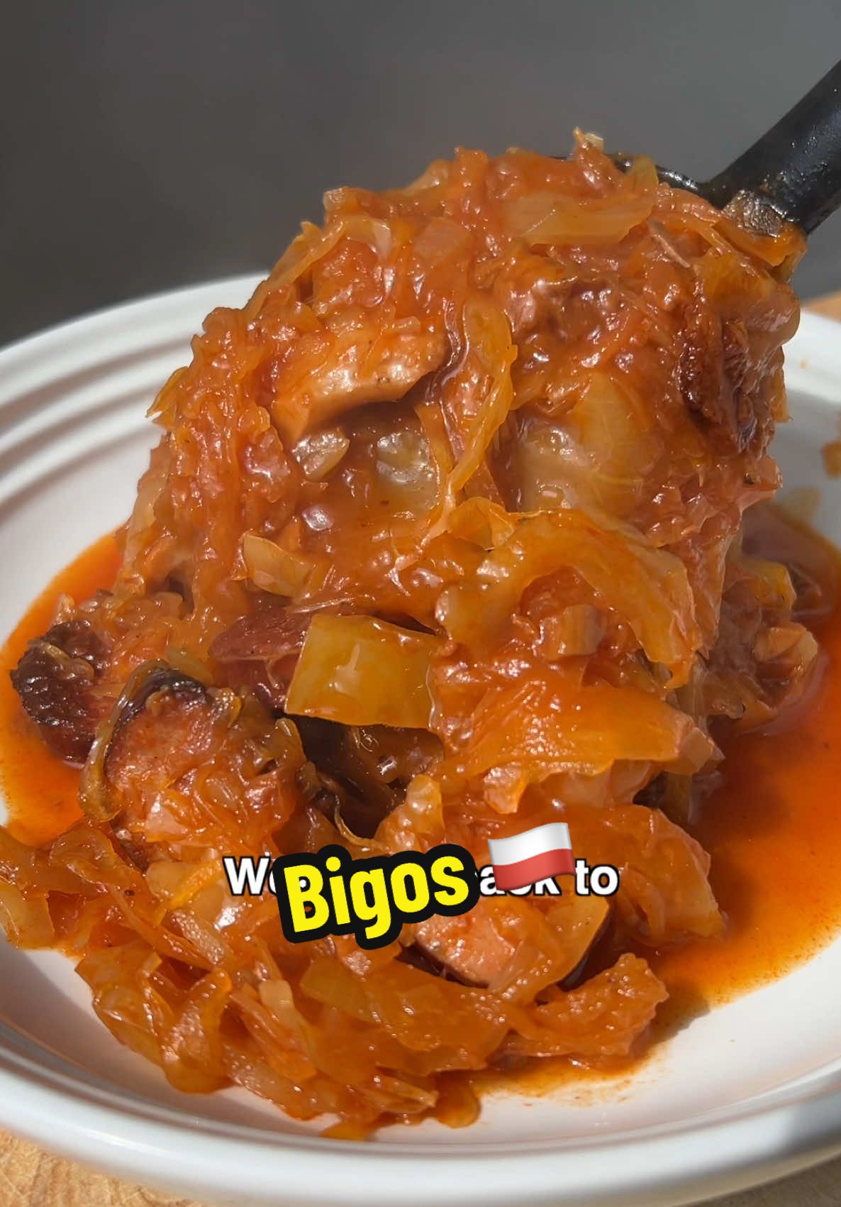 WELCOME TO STEWS FROM AROUND THE WORLD 🌍 This is part 11 and today we’re taking a trip to Poland to make some Bigos 🇵🇱 (4) 1 brown onion diced 50g chopped porcini mushroom 1/4 white cabbage 3 tsp tomato paste 150ml red wine 250g Sauerkraut 50g bacon 150g pork shoulder cubed 100g pork belly cubed 150g beef shank cubed 1 polish smoked sausage  1/2 red apple diced  1 small carrot diced 800ml chicken stock approx* Salt & pepper to taste (1) Heat up a large stew pot on a medium heat, then add your onion and cook for a few minutes until soft. Now add your porcini mushrooms and saute for a further few minutes. Now add your tomato paste and cook for 5 minutes until dark red but not burnt, then go in with some red wine to de glaze.  (2) Reduce the red wine by half, then add your Sauerkraut and mix well, cover and let cook for 15 minutes, while we prepare our meats. (3) Heat up a large cast iron skillet on a medium high heat, then once hot, add some oil and add your bacon to render off some of its fat, then remove. Now add the pork belly, shoulder and beef shank and cook until brown all over then remove. Finally add your polish smoked sausage and cook until for a couple of minutes until brown all over, then remove. (4) Now add all the meats to the pan including the apple, carrots, prunes and stock, then seaoson to taste with salt and pepper and bring to a boil, then simmer for 2 hours until all the meat is tender. Serve with some bread. #stew #bigos #polishfood #poland 