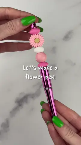 Looking for the cutest pen this Valentine's Day? 💖 Decorate your own with silicone beads and gift your creation to your special someone! 🎁💝 These customizable pens make the perfect simple craft for anyone! 💞 ✂️ Materials - • Pen Bead-Able - Metallic Fuchsia • Silicone Focal Bead Sunflower - Candy Pink • Silicone Bead Abacus Disc - Snow • Silicone Bead Round - Liquid Rose Quartz • Silicone Bead Lentil Disc - Pink 🌟 Want to recreate this project? Check out our website for all your crafting needs! 🔗 in bio! #beads #siliconebeads #handmade #custompen #DIYCraftWarehouse