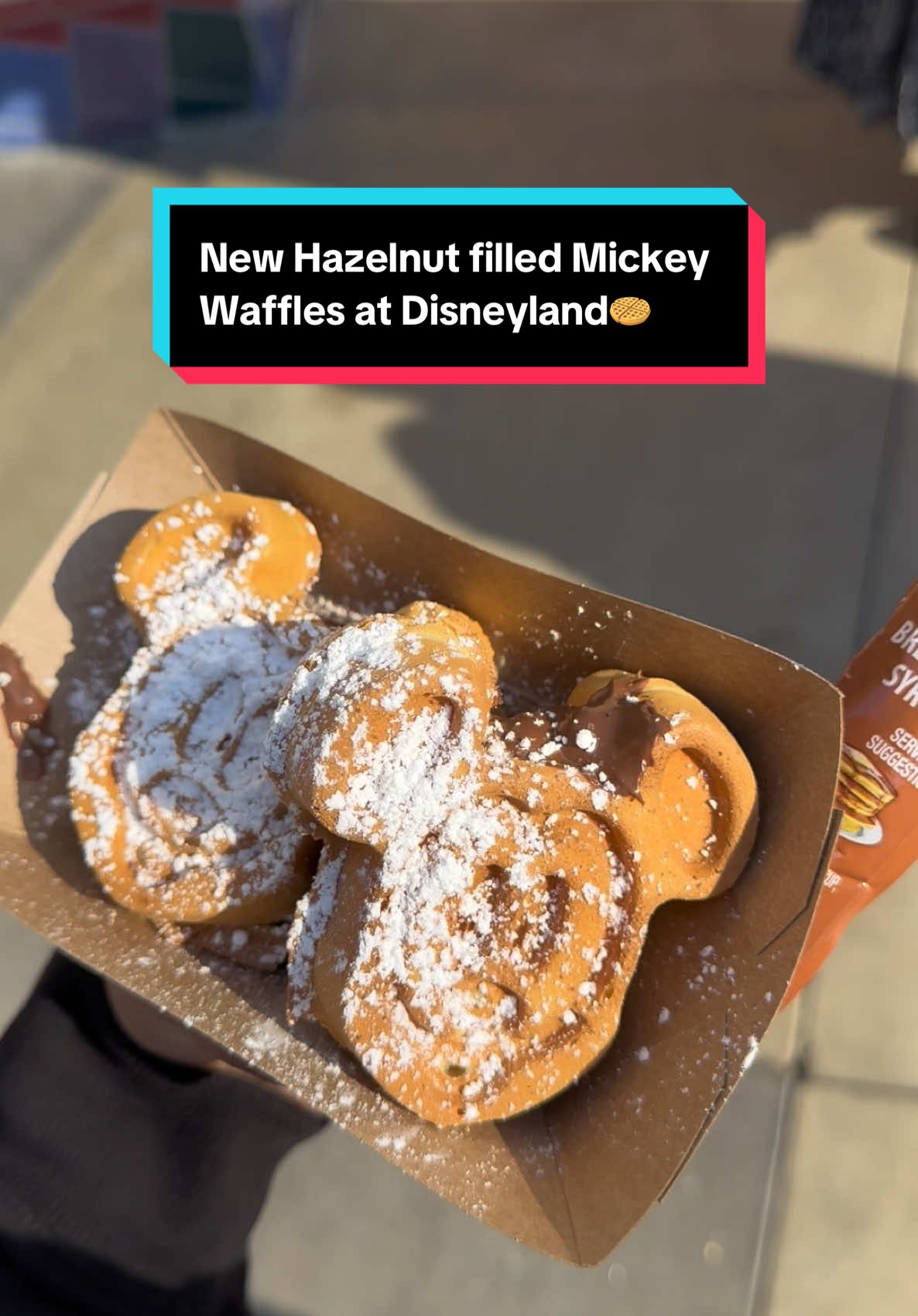 New Hazelnut filled Mickey Waffles at Schmoozies🧇 10/10😋 price is $10.99 #disneyfoodie #distok #disneytiktok #disneyfood #mickeywaffles #mickeyhazelnutwaffles #disneycaliforniaadventure #disneylandresort #disneyland #disney #fyp #foryou #disneylandtiktok #disneyeats @Disney Parks 