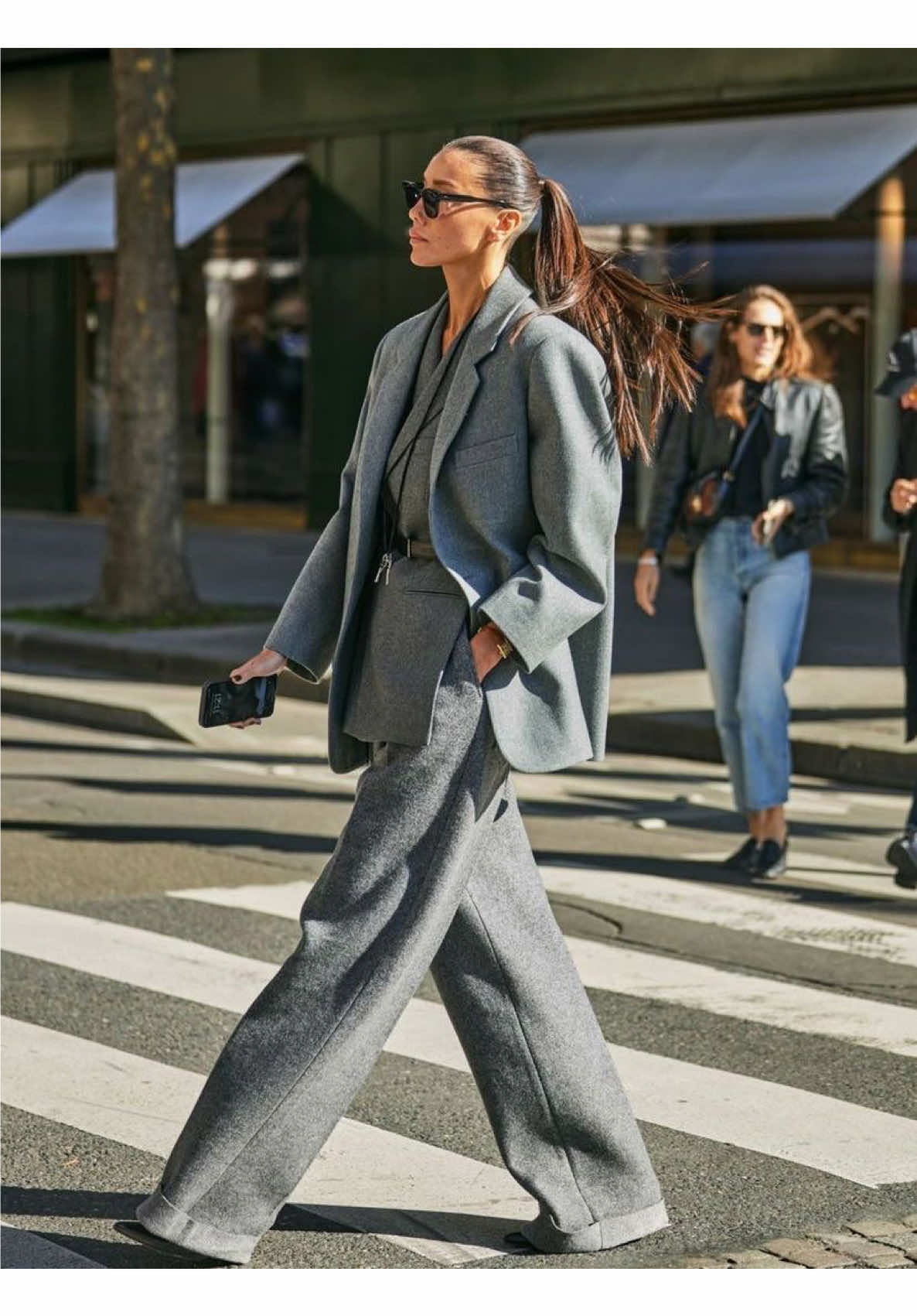 Oversized suits are redefining professional dressing for 2025, blending power and ease with fresh tailoring codes. Saint Laurent’s SS25 collection by Anthony Vaccarello leads the charge with bold suiting, pairing leather bombers and Wall Street-inspired trench coats with oversized eyewear for a modern take on ’80s power dressing. Bottega Veneta offers a relaxed alternative, championing fluid silhouettes and artful layering, including pants under wrap skirts and tunics paired with supersized jackets. Across the board, designers like Simone Bellotti at Bally and Stella McCartney embrace exaggerated proportions, while Tory Burch introduces belted, collarless styles for a softer approach. This season's tailoring balances masculine and feminine elements with a focus on contrasting textures, emphasizing confidence and individuality in the workplace.  #Fashion #FashionInspo #FashionStyle #OutfitInspo#ForYou #FYP #Style #StyleInspo #CelebrityFashion #CelebrityStyle #StyleTips #Viral #FashionTrends #FutureFashion #Style2025 #Fashion2025 