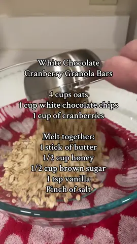 White Chocolate Cranberry Granola Bars ❤️ pour melted mixture over dry ingredients and mix well until everything is combined. Pour mixture into 9x13 dish and push down until evenly distributed. Refrigerate and then cut into bars. We keep ours in the fridge all week and they stay fresh all week!  #granolabars #cranberrygranolabars #breakfastideas #bakingathome #baking #homemadefood #homemadekitchenrestock #cookingfromscratch #cookingathome #bakingrecipe 