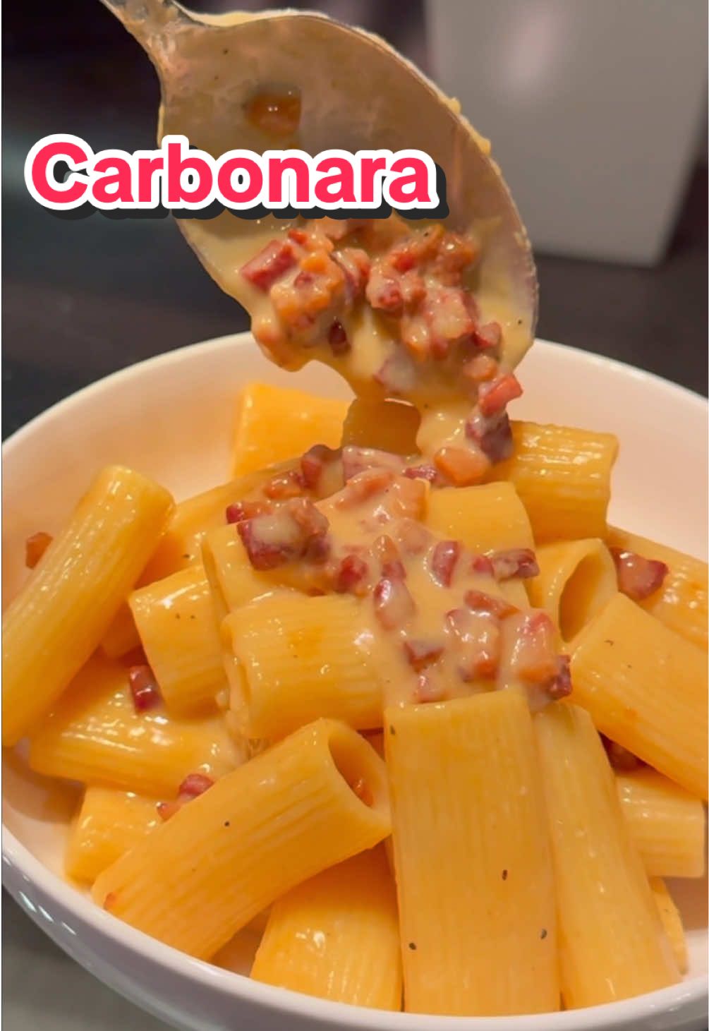 Things I learned in culinary school: Rigatoni Carbonara ❤️ Ingredients: 12oz rigatoni  4 egg yolks at room temp  4 oz diced pancetta or guanciale 1/2 cup freshly grated pecorino  1/2 cup freshly grated parm Salt and black pepper  Step 1- boil pasta in salted water  Step 2- place diced pancetta in a cold pan, turn on medium heat and stir occasionally until the fat is rendered and the pancetta is crispy Step 3- in a bowl mix egg yolks with cheese  Step 4- remove crispy pancetta, with pan still very hot add in black pepper, al dente pasta, and about 1/2 cup pasta water and mix well Step 5- right after, turn the burner off, add in the cheese mixture to the center and mix very well to combine, add back in the crispy pancetta Taste and season as needed with salt and black pepper  Let me know if you have any questions 🫶🏻 #Recipe #pasta #carbonara #italianfood #cooking #athome #foodtiktok 