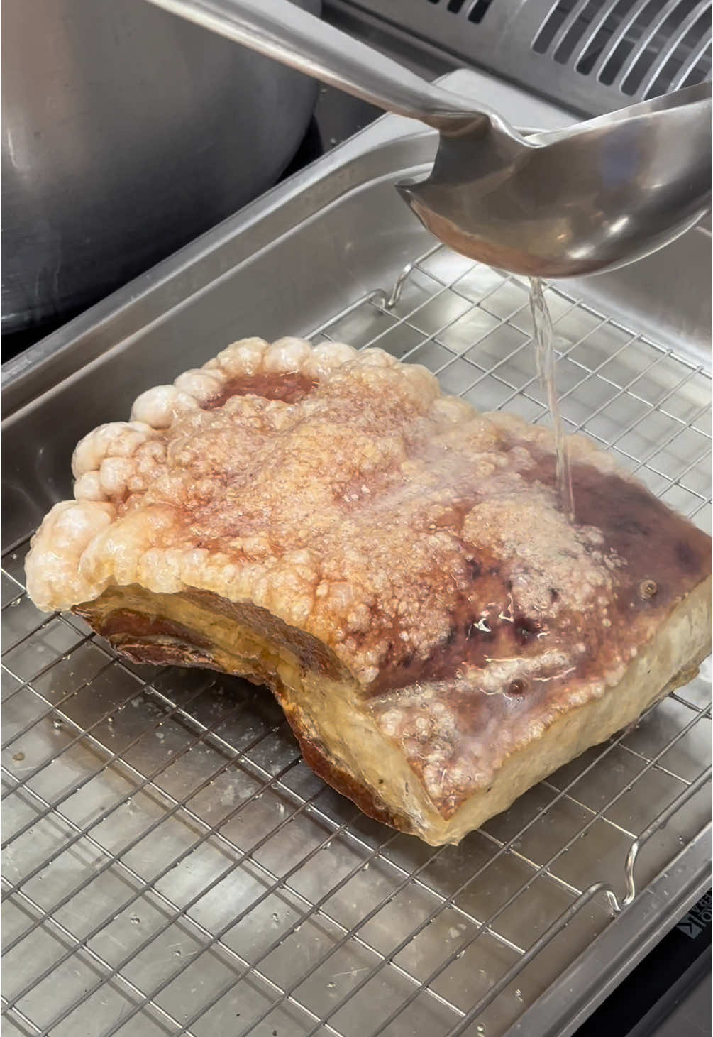 SOUND ON FOR CRISPY CRACKLING 🔊⁠ Crackling is the holy grail of pork belly. That golden, shatteringly crisp skin is pure joy. Score the skin, pat it bone-dry, and then for the showstopper: pour shimmering hot oil over the surface. Watch the skin crisp and puff into golden perfection. ⁠ A little note of caution: this involves very hot oil, so take care, move slowly, and have a steady hand! #crackling #porkcrackling #crispycrackling #porklover #porkbelly #britishpork #hgwalter