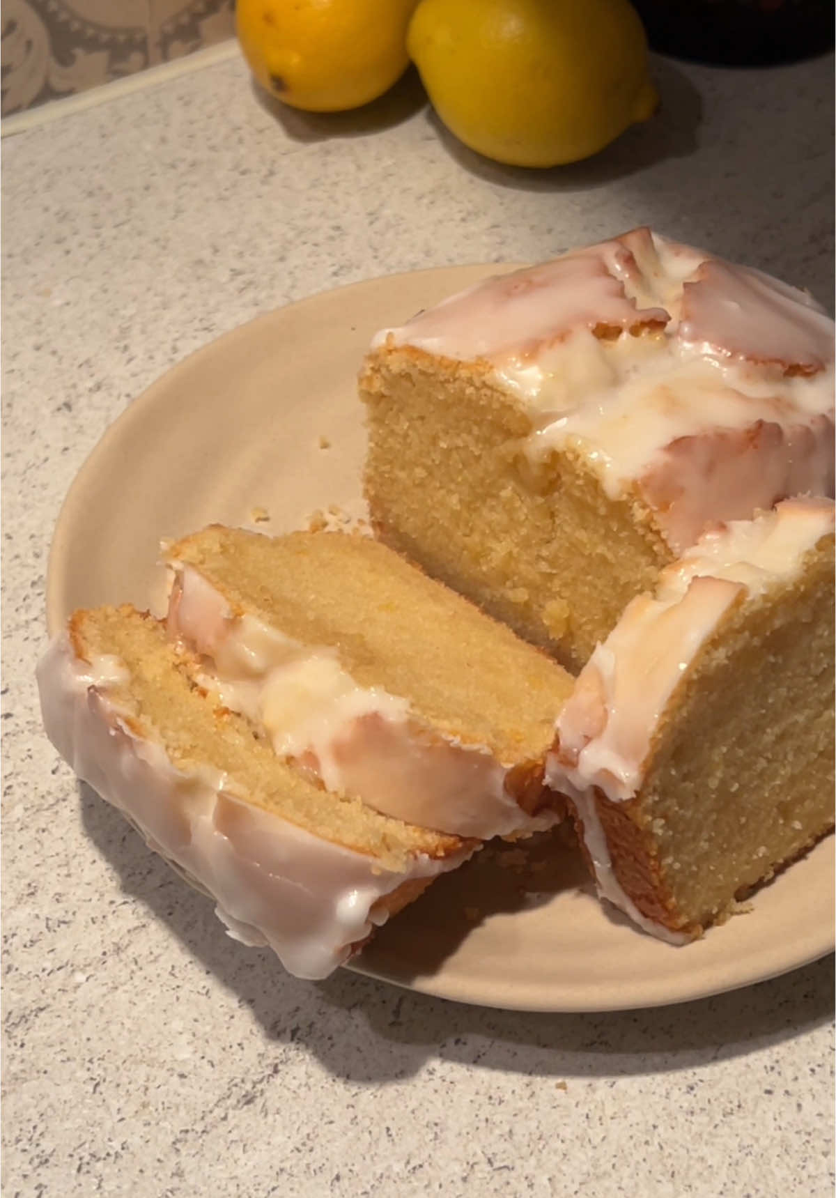 Fluffiest lemon loaf cake ever 😮‍💨🩷 ⭐️Ingredients⭐️ 115g unsalted butter, room temperature  1 tbsp vegetable oil 120g sugar 2 eggs, room temperature  1 tsp Vanilla extract 80ml milk 1 tbsp lemon zest 1 tbsp Lemon juice (15ml) 150g flour 1 tsp baking powder Bake in a preheated oven at 180°C for 45 minutes! 💕 Icing  100g icing sugar 1 tbsp lemon juice 1 tbsp milk Preheat the oven and prepare a loaf pan.   Cream the butter, vegetable oil, and sugar until light and fluffy.   Add eggs one at a time, mixing well after each addition.   Sift together flour and baking powder, then mix into the batter.   Stir in milk, lemon zest, lemon juice, and vanilla extract until smooth.   Pour the batter into the pan and bake until golden and a toothpick comes out clean.   Mix icing sugar with lemon juice and milk until smooth.   Drizzle the icing over the cooled loaf and serve. #baking #lemonloaf #lemonrecipes #lemoncake 
