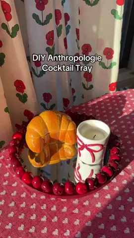 Anthropologie Cherry Cocktail Tray DUPE!! 🍒🍒🍒 Directions: Remove mirror from frame and set mirror aside Apply two coats of wine red paint to frame and let dry Cut most of the stem off the cherries, leaving just a short bit at the base Paint the cherries a variety of deep red shades (I used a wine red, berry red, and imperial red) and let dry Use E6000 craft glue to apply cherries to the frame Spray 2 coats of acrylic gloss finish and let dry Add mirror back in frame  Enjoy!!  Supplies I used: 11.7inch basic wood mirror  Artificial cherries (34 cherries for an 11.7inch frame) E6000 craft glue Acyric paint (I used wine red, berry red, and imperial red) Paint brushes Alene’s acrylic sealer gloss finish  #diyproject #anthropologiedupe #colorfulhome #homedecor #dopaminedecor #DIY 