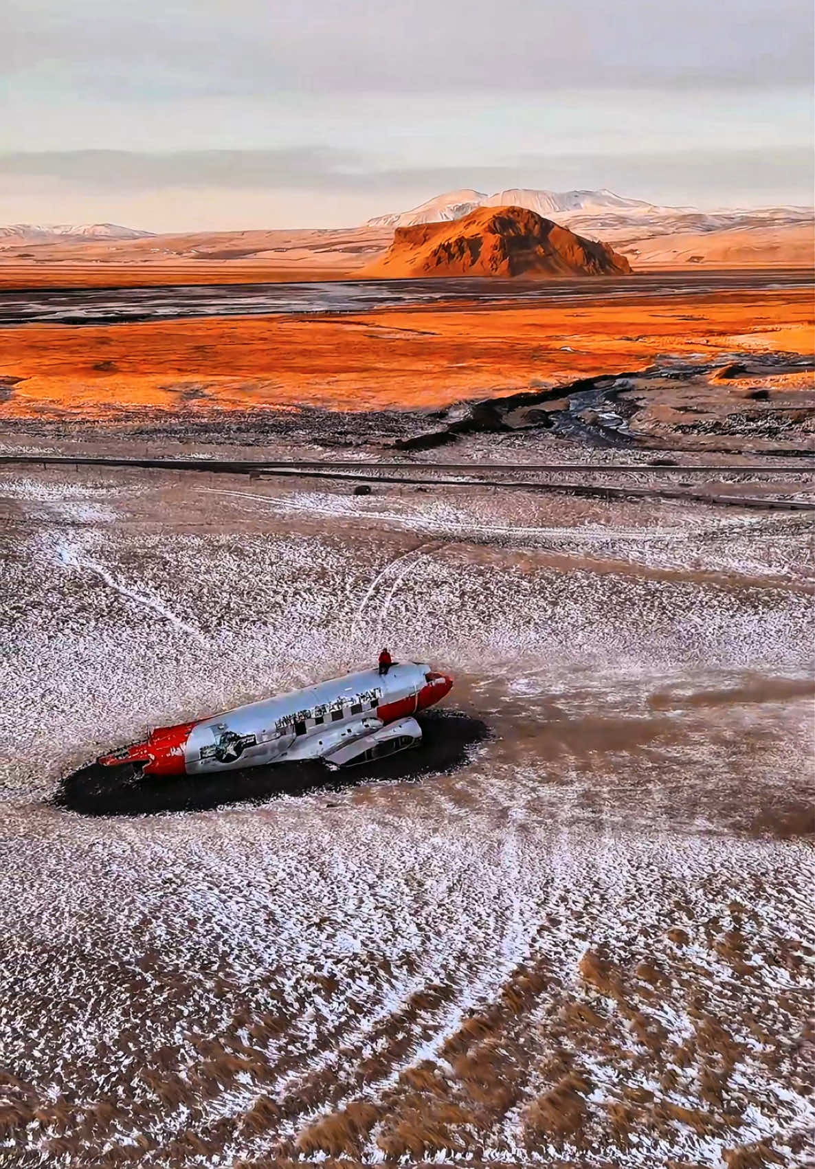 📍DC-3 Airplane Wreck, Iceland 🇮🇸  The DC-3 Airplane Wreck is a famous crash site of a U.S. Navy Douglas C-47 (a military version of the DC-3) located on the black sand beach of Sólheimasandur, Iceland. The plane crashed in 1973 due to a reported fuel exhaustion, though the crew later realized they had simply switched to an empty fuel tank. Fortunately, all crew members survived. #travellingthroughtheworld #travelphotography #travelstory #iceland #airplanewreck #airplane #sunset #vusalmehmetabid #formysoul 