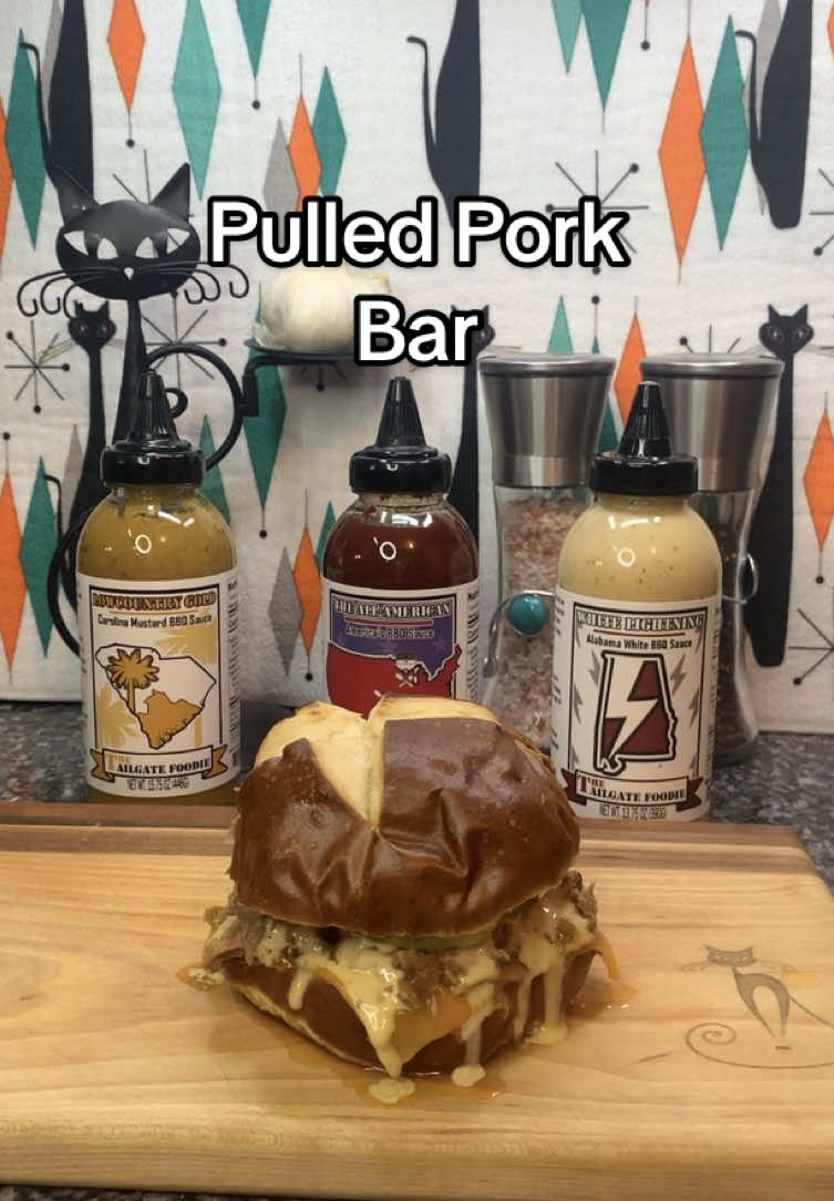 Pulled Pork Bar!! Yep, one of my favorite game day spreads to do. @thetailgatefoodie sauce trio along with slow-cooked flavorful pork (or chicken), a variety of buns, various cheese & toppings…choose your sauce & get to eating!  White Lightning: Creamy & tangy with hints of apple cider vinegar, brown sugar, Mayo & cayenne.  All American: Texas brings the heat. KC brings the sweet, savory from Memphis & a punch of vinegar from the Carolinas.  Low Country Gold: Tangy mustard, sweet brown sugar, tough of cayenne & a punch of vinegar.  Pulled Pork:  * 7 lb Bone-in Boston Butt or Pork Shoulder  * 1 Large Onion - Sliced  * 6 Cloves Garlic - Minced * 1 Cup Chicken Broth * 2 Tbsp Dark Brown Sugar * 2 Tbsp Chili Powder * 2 Tbsp Kosher Salt * 2 tsp Cumin * 1 tsp Smoked Paprika  * 1 tsp Onion Powder * 1 tsp Garlic Powder.  Season pork with rub mixture. Add sliced onion, garlic & broth to the bottom of a crockpot. Top with the pork & cook on low for 12 hours.  #pulledpork #pulledchicken #bbqsauce #sauces #gamedayfood #NFLPlayoffs #slowcooker #alabamawhitesauce #carolinamustardsauce #tailgatefood #tailgatefoodie  