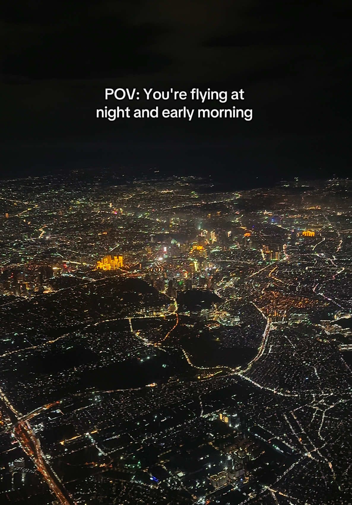 Sometimes all it takes is a view like this to remind you that life’s short—so go ahead, book that flight and make some memories! 😂✈️ #fyp #foryoupage #airplane #airplaneview #windowseat #citylights #sunrise 