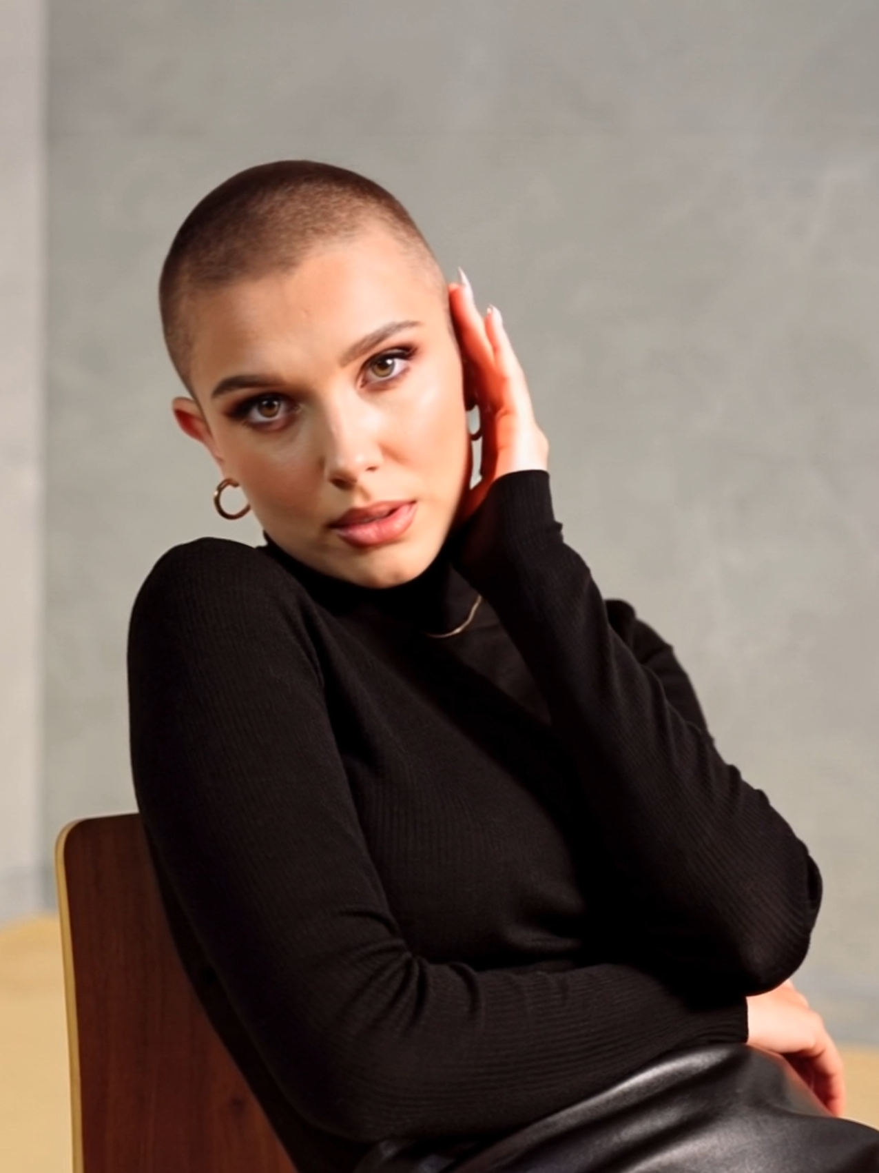 Millie Bobby Brown imagined with a buzzcut – this edit gives us major Eleven vibes but with a fresh, modern twist. 🌟 What do you think of this bold look? 🔥 #MillieBobbyBrown #BuzzcutEnergy #ShavedHead #creatorsearchinsights 