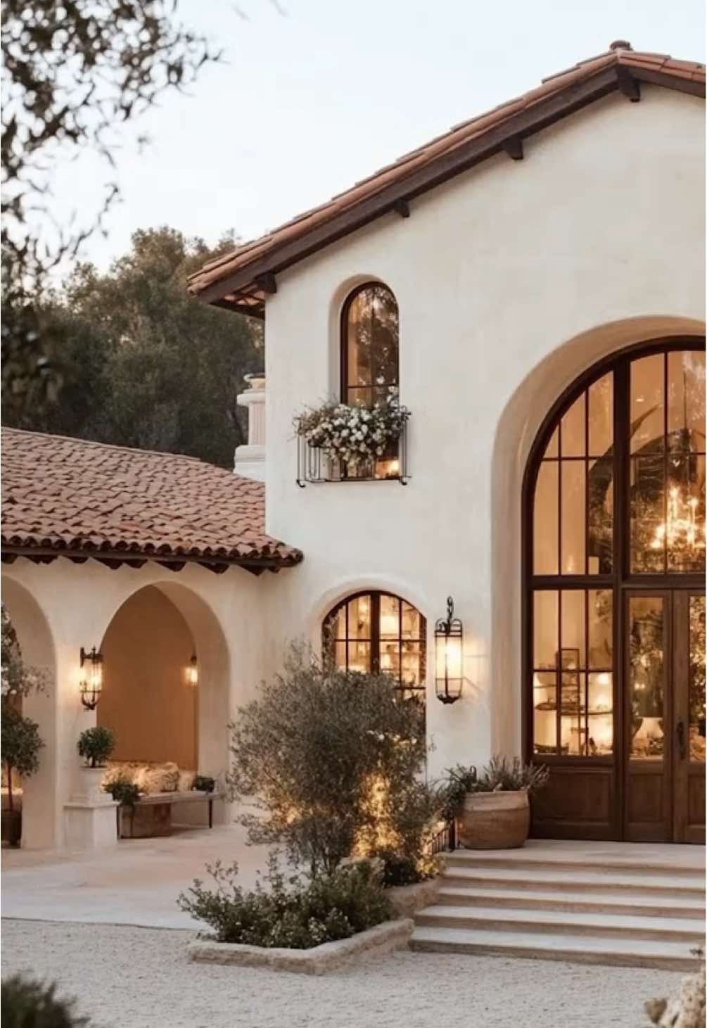 This vintage Spanish-style home captures warmth and character with arched windows, terra-cotta roofing, and wrought iron details. Natural light pours into the airy interiors, highlighting earthy tones and rustic touches. The lush greenery and timeless design make it both cozy and elegant. #homedecor #interiordesign #homeinspiration #timelessinterior #homedecorideas #interiordesignideas #homestyling #interiortrends #homedecorlovers  #furnitureideas #porsche911 