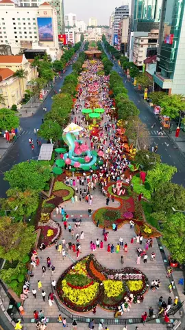 Nguyen Hue Walking Street is glowing with Tet magic! 🌸✨ From the dazzling lights to vibrant decorations, the heart of Saigon is alive with Lunar New Year spirit. Capturing these festive vibes from above truly showcases the city’s beauty and energy. 🧧🎇 #NguyenHue #TetInSaigon #DroneViews #saigon #hochiminhcity #tet #newyear #explorevietnam 