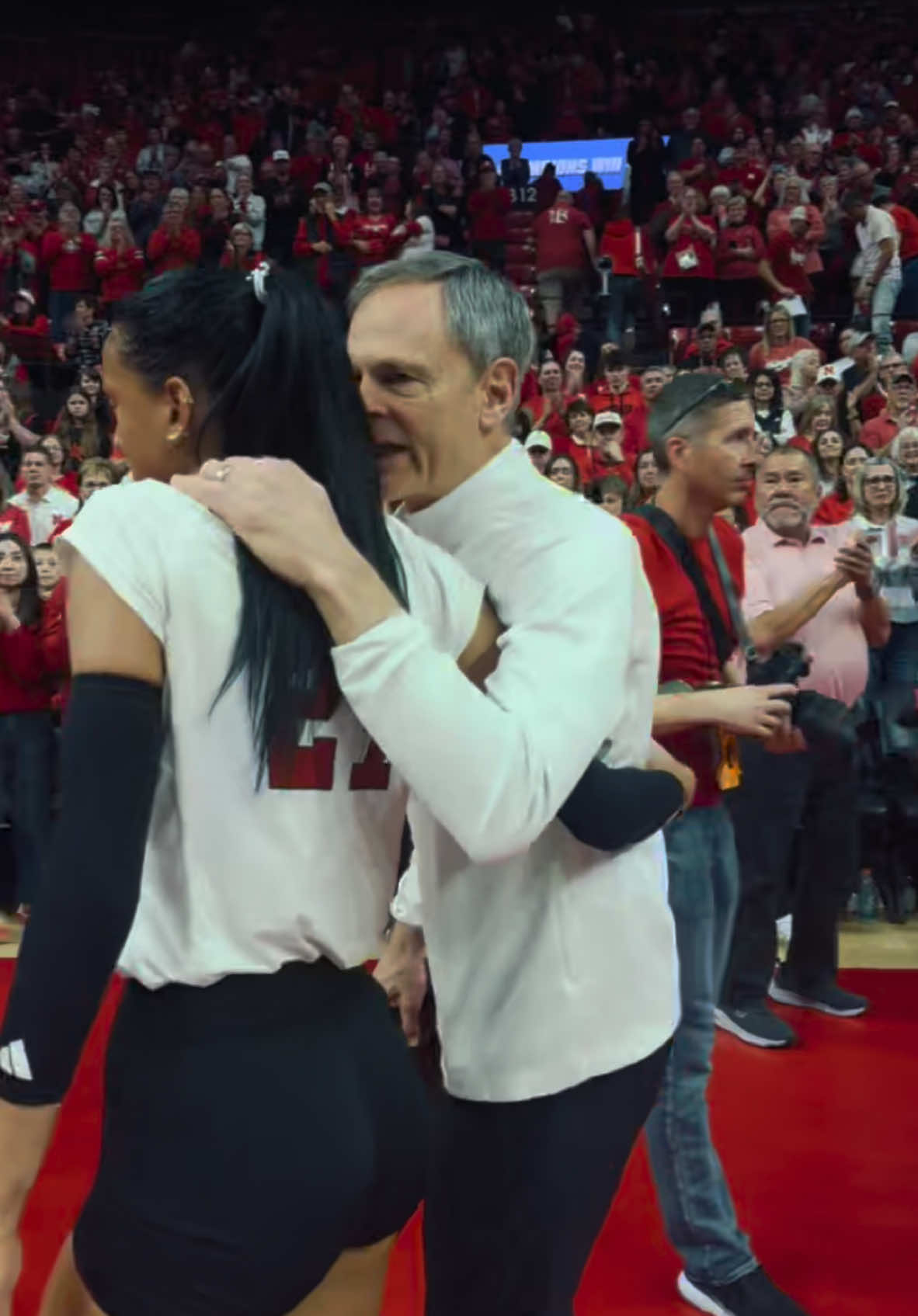i would’ve never thought this would be John’s last game in Bob after 25 years but what an honor it was to be the one to walk out with him. I can’t thank John enough for what he has does for me and my family. He stuck by my side and brought back a smile that I thought was gone forever. It’s nearly impossible to put into words how much of an impact he has had on me and I will do everything I can to make him proud for the rest of my life. He deserves the world and nothing less. I love you coach thank you for everything ❤️@coachjohncook1 @Nebraska Volleyball 