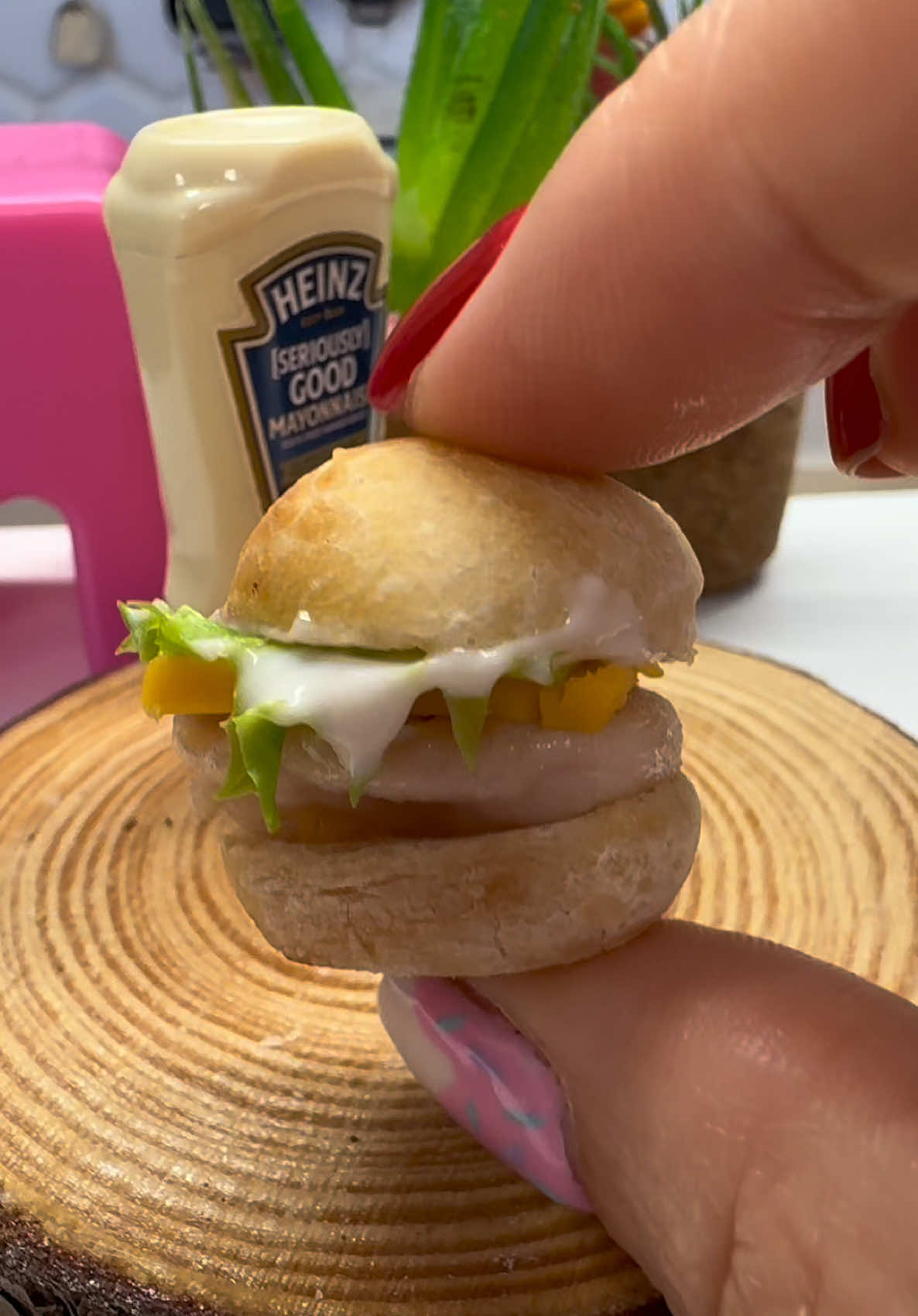 Mini Chicken Burger in the mini bakes kitchen- keeping plain this time with fried chicken and cheese, mayo and lettuce on a lil white bread roll ! What’s your fave type of chicken #chicken #burger #minifood 