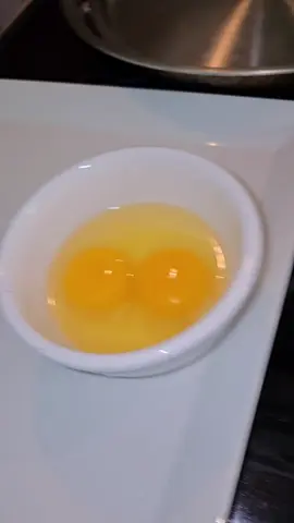 steak n eggs but cooking the steak first on a stainless steel pan 