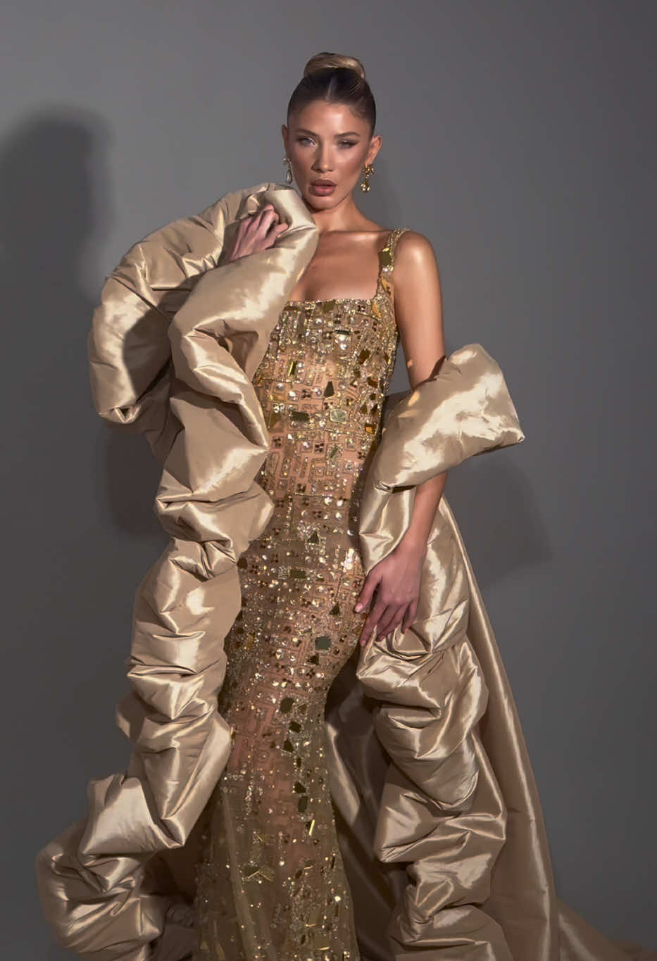 Step into elegance with our new  “Eternal flame”  Couture Collection    Gold couture dress with fluffy cape ! www.fjollahaxhismajli.com #vogue #harpersbazar #cosmopolitan #allure #vanityfair#fashiondesigner #houtecouturedress #fjollahaxhismajli#reddress#style#fashion @FJOLLA HAXHISMAJLI @BlendRoka.photography_film 