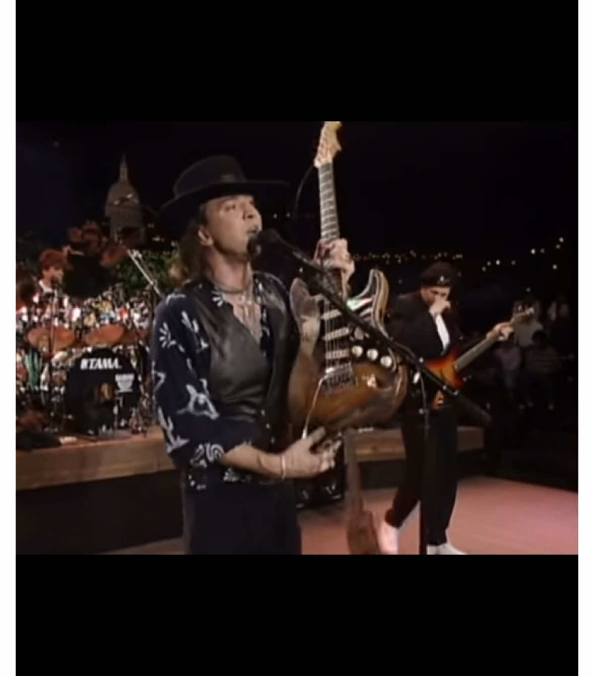 The 1989 Austin City Limits performance of Stevie Ray Vaughan’s “Little Sister” is legendary. During the performance, he’s on stage, wearing his signature style: a black vest over a button-up shirt, with his dark hair flowing as he shreds on his Stratocaster. The magic moment comes when, after playing the opening part of the song with his main guitar, he switches to his backup mid-solo. It’s seamless—he doesn't miss a beat. You can see how in tune he is with the music and the audience as he continues to pour out his bluesy, fiery guitar licks. The switch feels almost like part of the performance’s natural flow, adding to the intensity of the moment. Vaughan's trademark fiery energy and skill come through with each note, and that smooth transition—no awkward pause, just raw talent and instinct—adds to the raw excitement of the live show. His intensity, emotional expression, and mastery of the guitar are fully on display, making it one of his most iconic performances. #fyp #rock #metal #blues #jazz #guitarists #guitar #70s #guitartok #srv #stevierayvaughan 