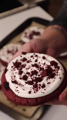 Red Velvet Crumbl Style Cookies! Ingredients: 2 packs Red Velvet Cookie Mix (Dollar Tree) 1 stick margarine or butter softened  1 egg or 1/4 cup unsweetened applesauce 1 8 ounce can of cream cheese frosting 1/2 jar marshmallow fluff Mix cookie mix with margarine and egg (or applesauce) and chill for at least 1 hour. Scoop into 8 large cookies and bake at 350 degrees for 18 minutes.  Let cool completely. Mix cream cheese frosting with marshamllow fluff for a glossy bright white frosting Crush one cookie to make red velvet crumbles. Frost the cookies and top with crumbles, enjoy! #redvelvetcookie #crumblcookiesoftheweek #valentinesdaytreats #budgetbaking #easybaking #dollartreefinds #cheapandeasyrecipes #crumblathome #dollartreedinners
